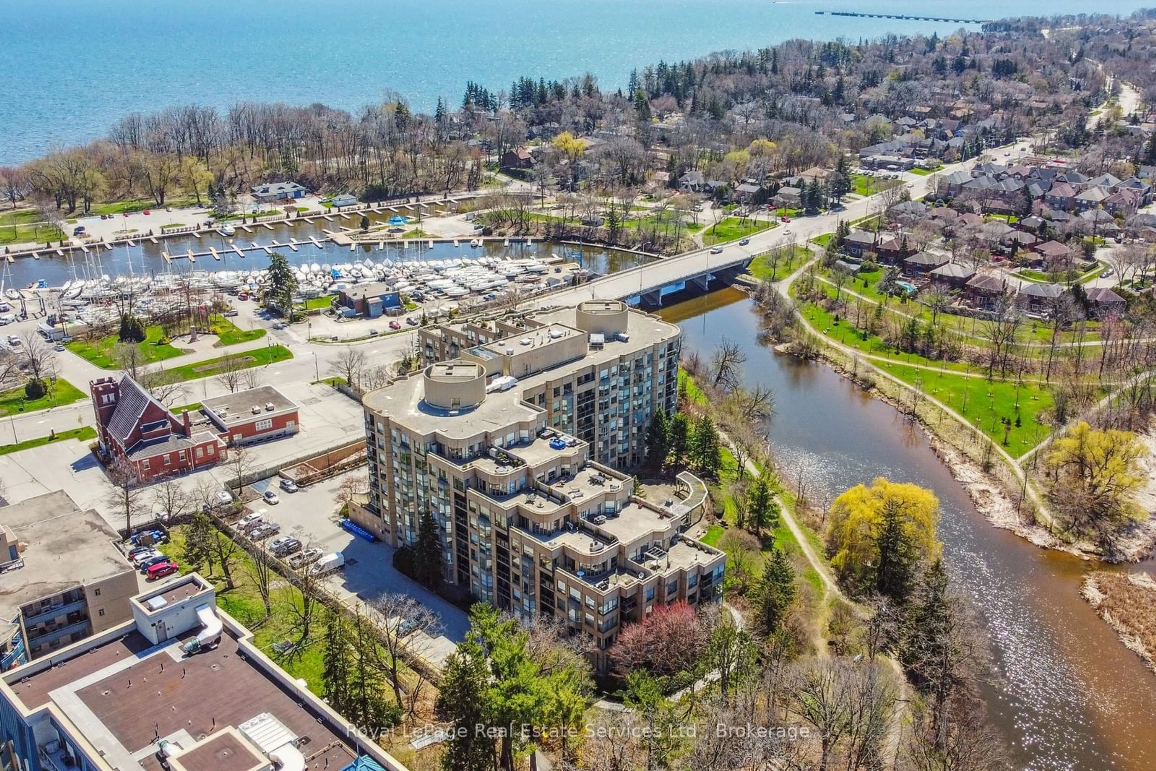 A pic from outside/outdoor area/front of a property/back of a property/a pic from drone, water/lake/river/ocean view for 2511 Lakeshore Rd #204, Oakville Ontario L6L 6L9