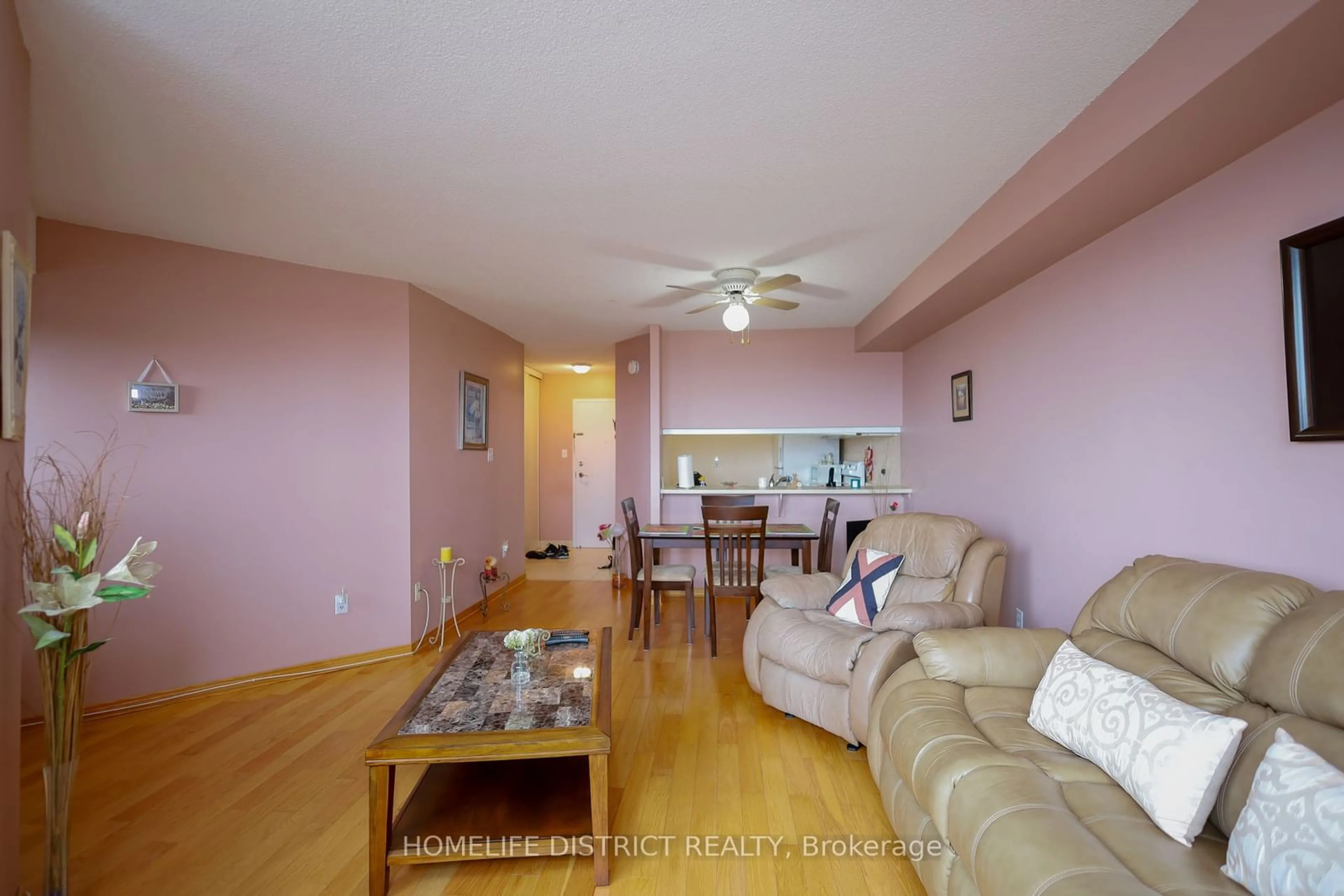 Living room with furniture, wood/laminate floor for 234 Albion Rd #1902, Toronto Ontario M9W 6A5