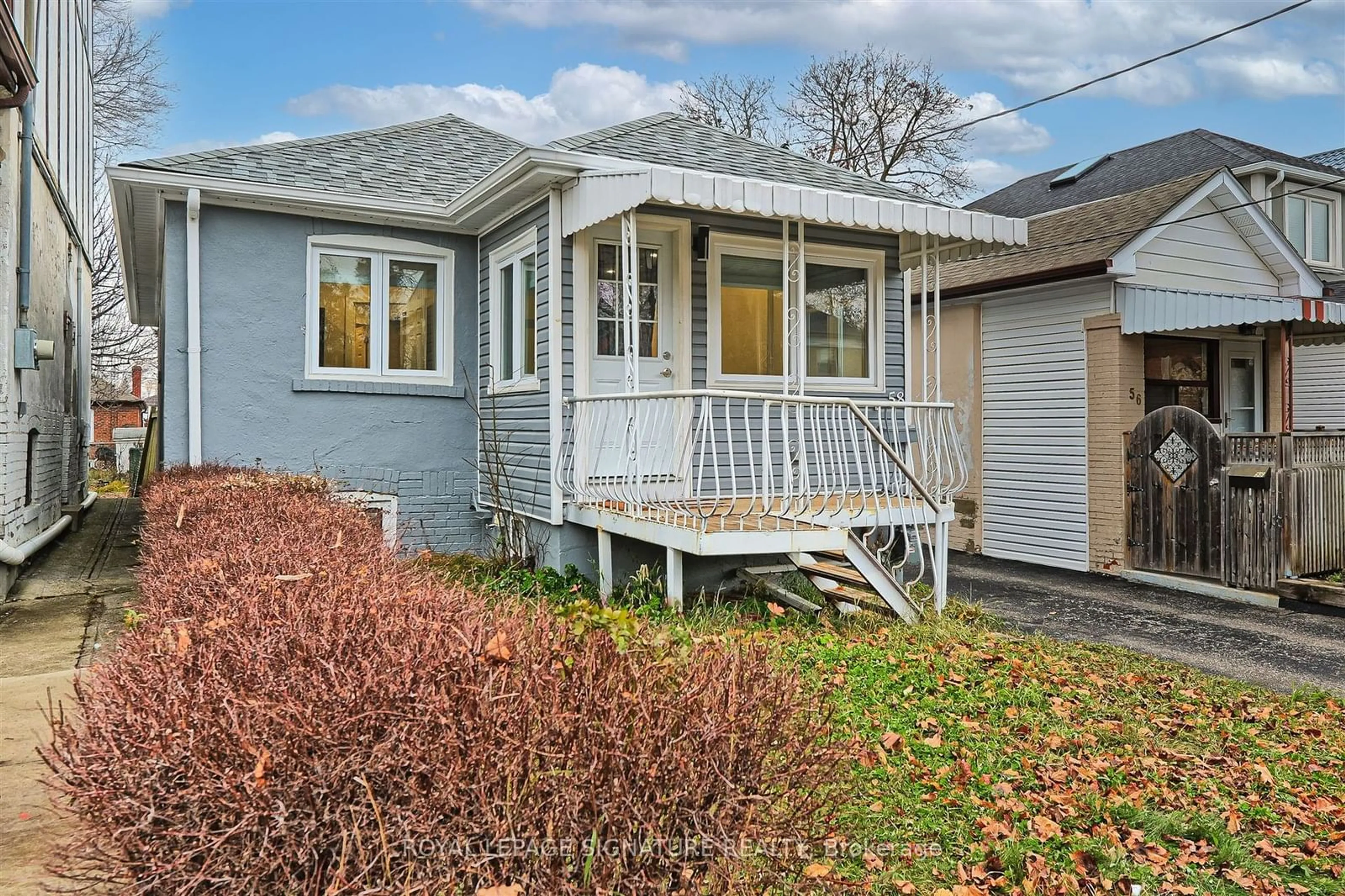 Home with vinyl exterior material, street for 58 Livingstone Ave, Toronto Ontario M6E 2L8