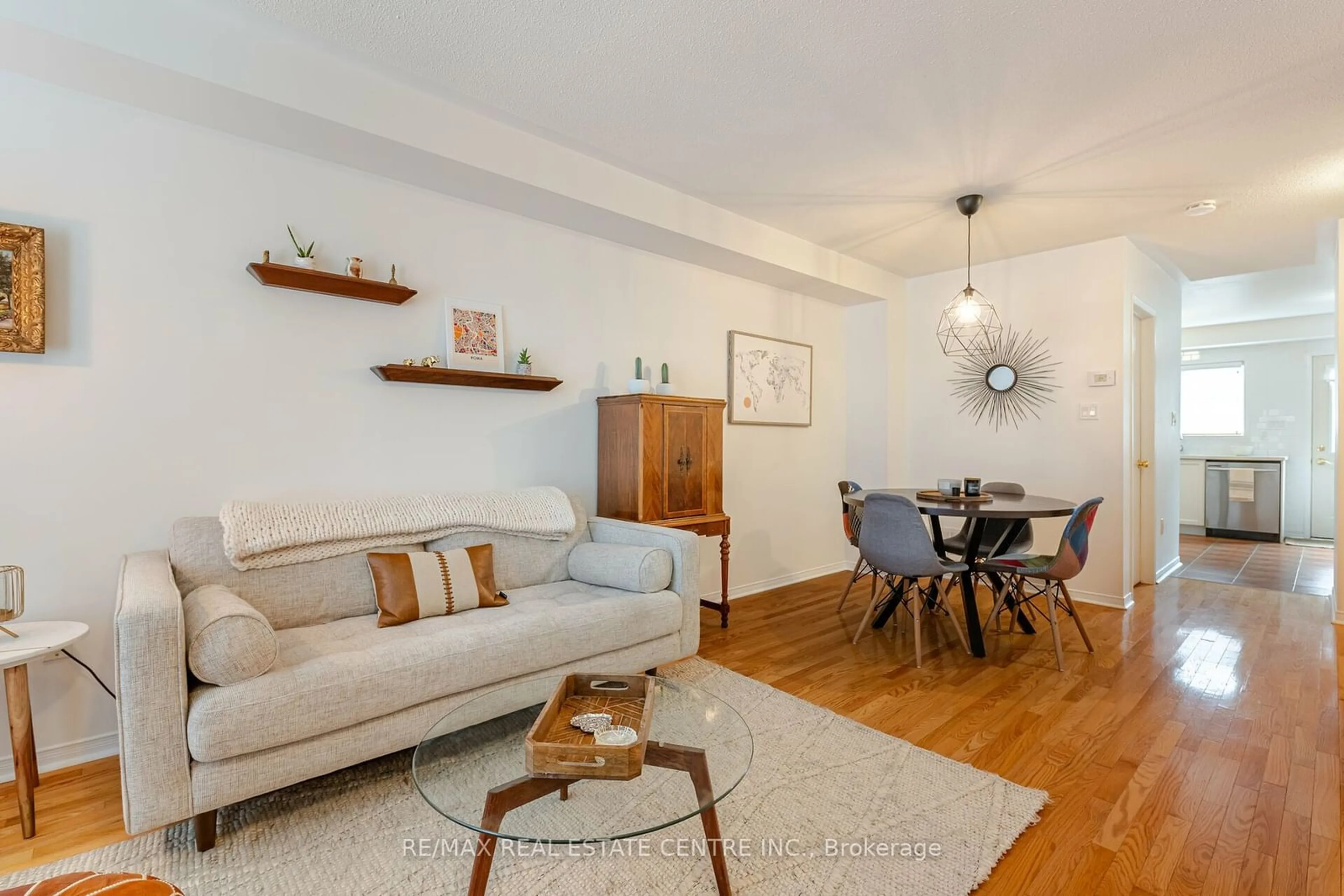 Living room with furniture, wood/laminate floor for 163 Brickworks Lane, Toronto Ontario M6M 5H8