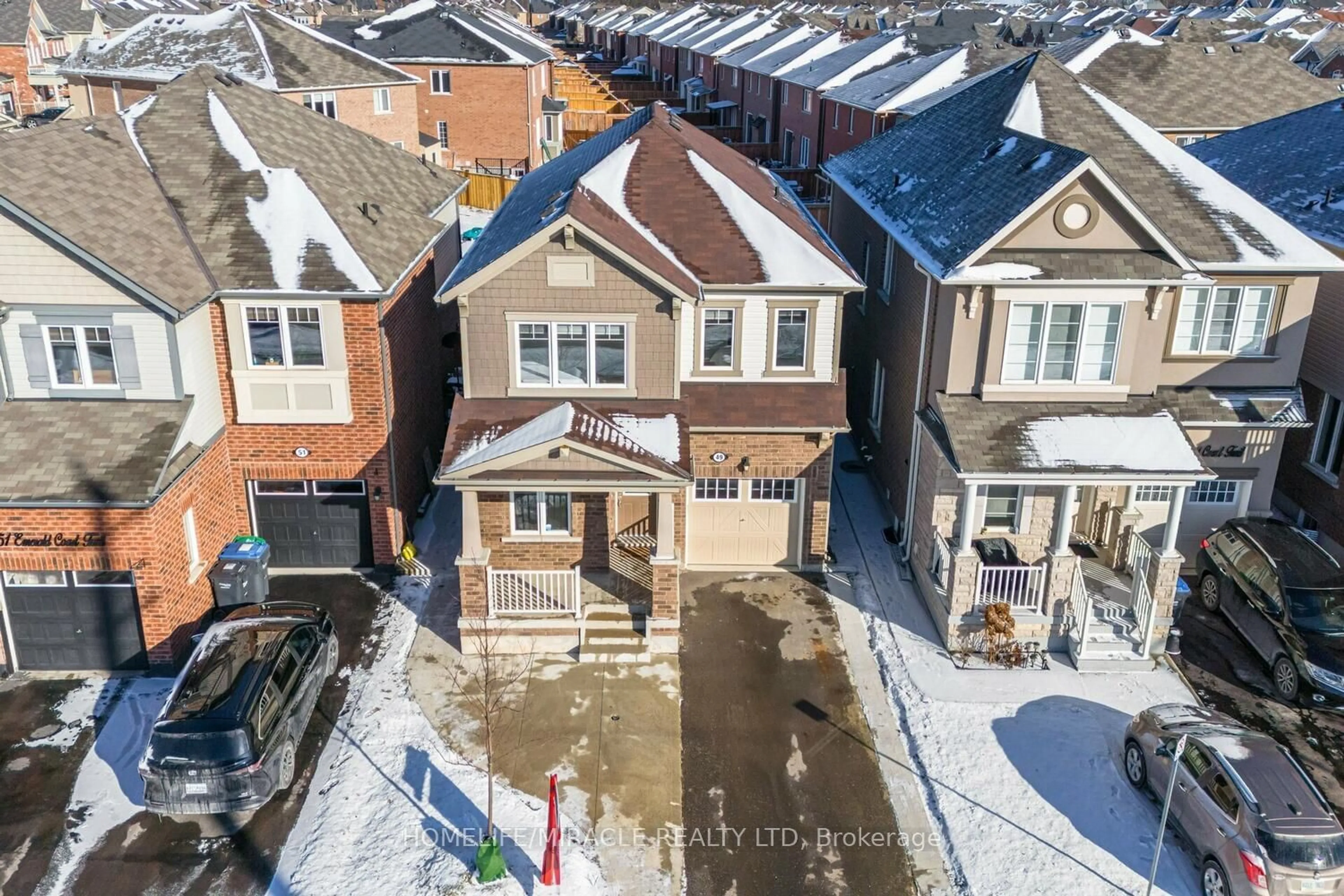 A pic from outside/outdoor area/front of a property/back of a property/a pic from drone, street for 49 Emerald Coast Tr, Brampton Ontario L7A 5A7