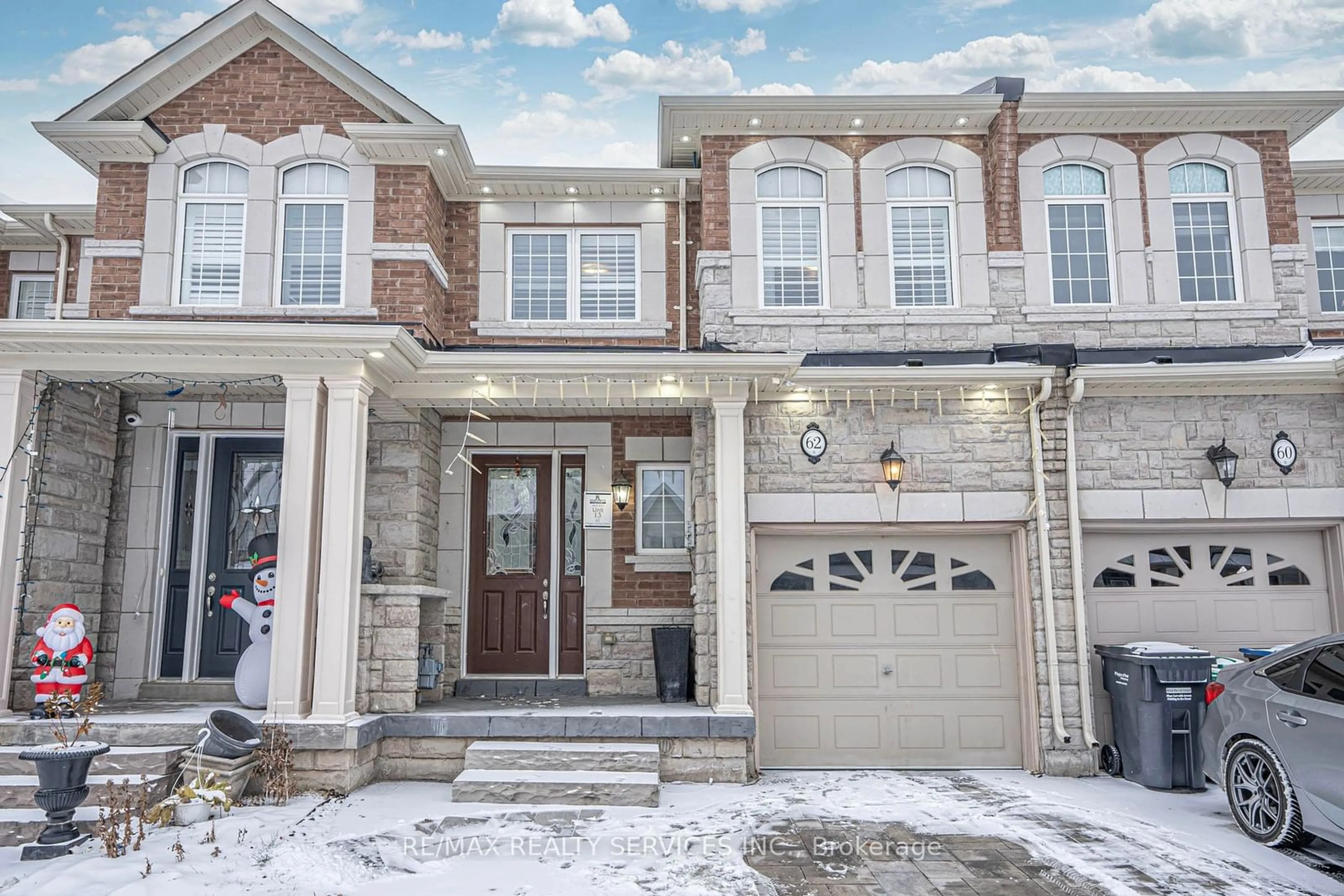 Home with brick exterior material, street for 62 Hogan Manor Dr, Brampton Ontario L7A 4V3