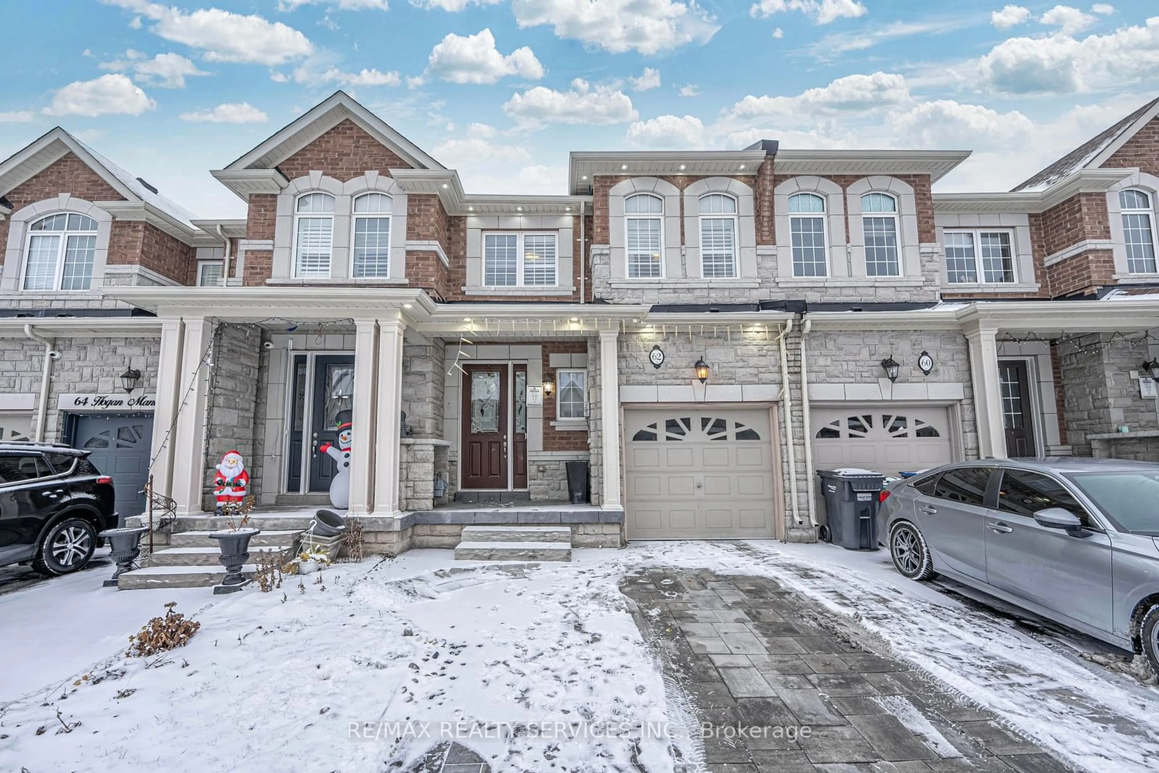 Home with brick exterior material, street for 62 Hogan Manor Dr, Brampton Ontario L7A 4V3