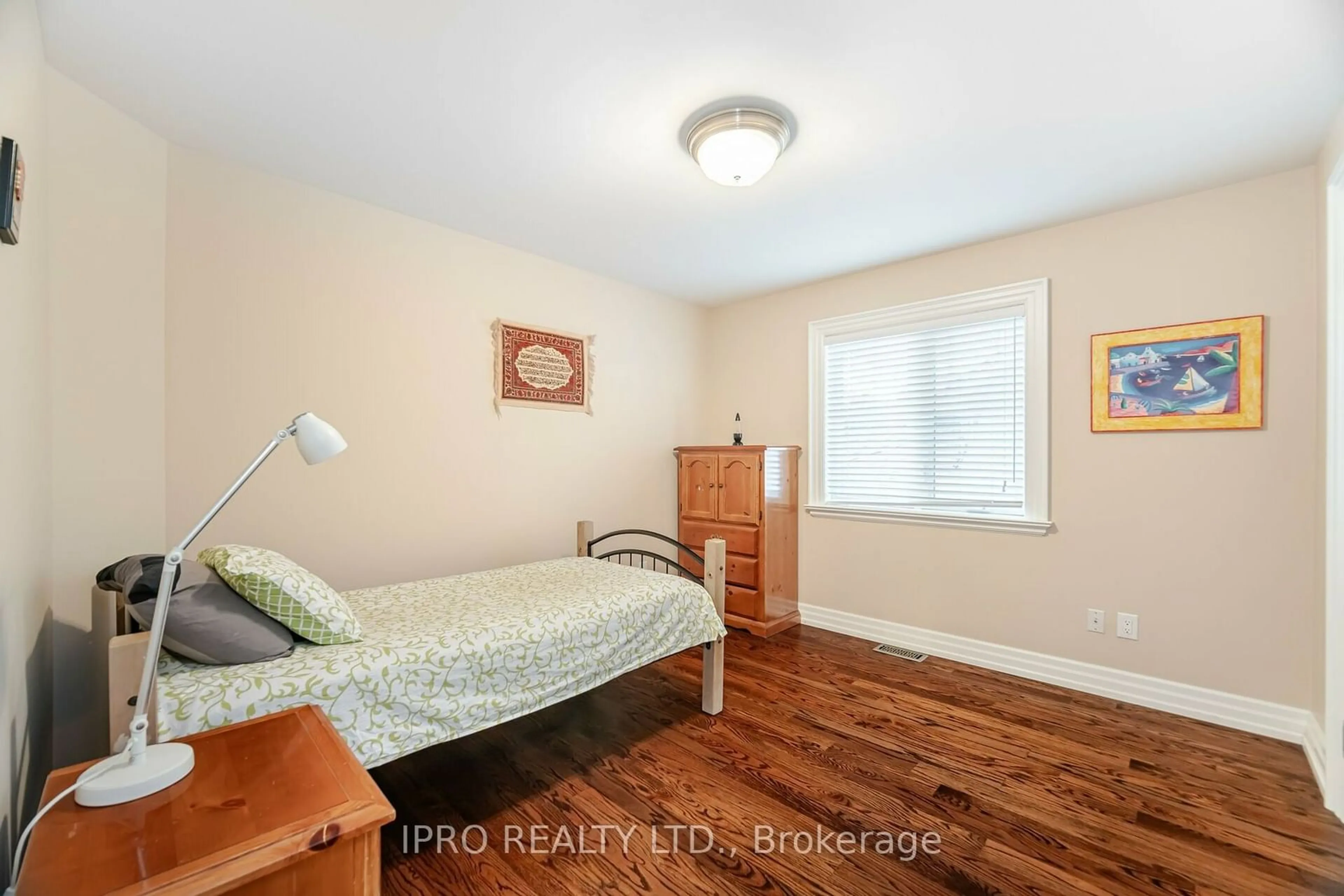 Bedroom with bed, wood/laminate floor for 1080 Haig Blvd, Mississauga Ontario L5E 2M5