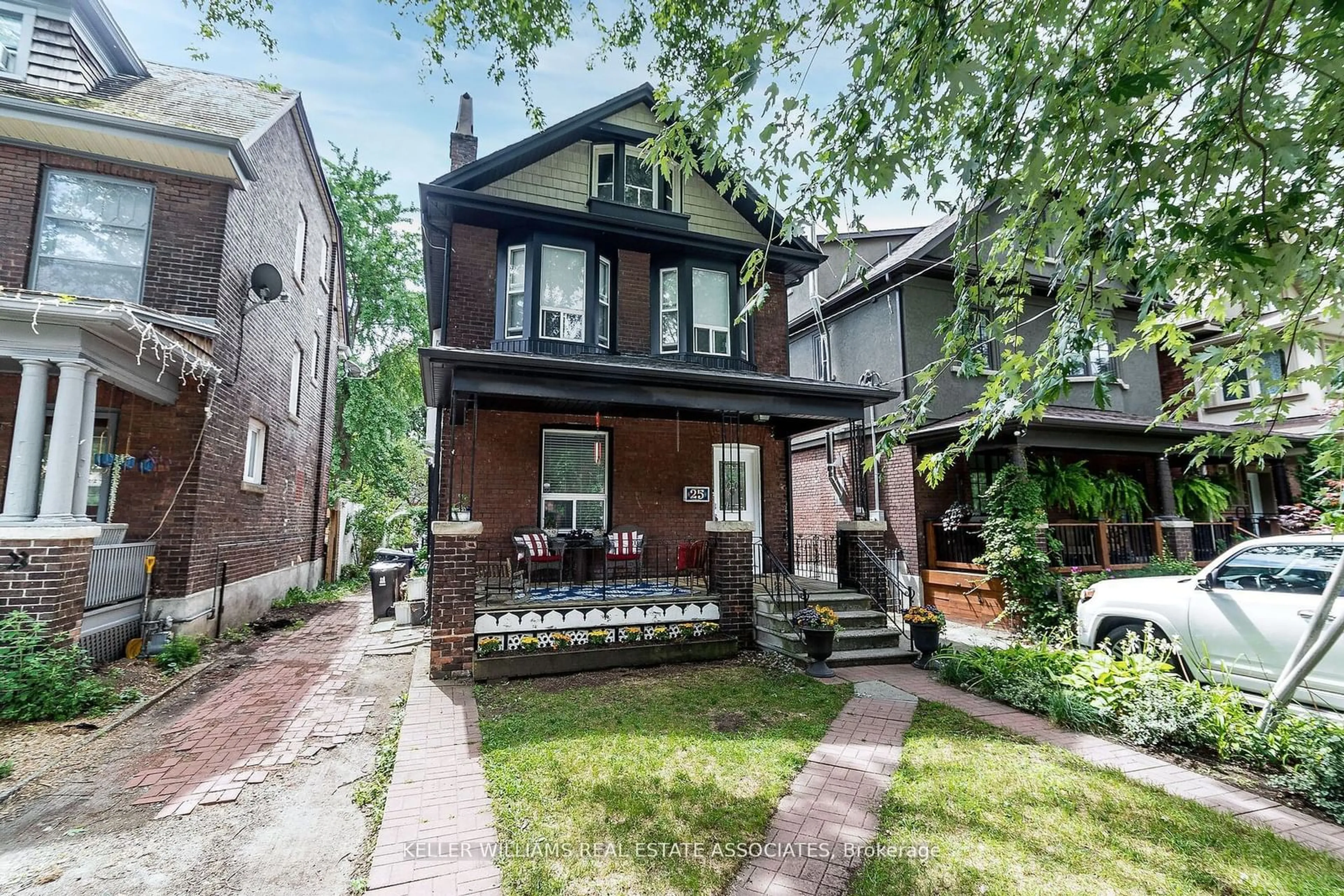 Home with brick exterior material, street for 25 Boustead Ave, Toronto Ontario M6R 1Y7