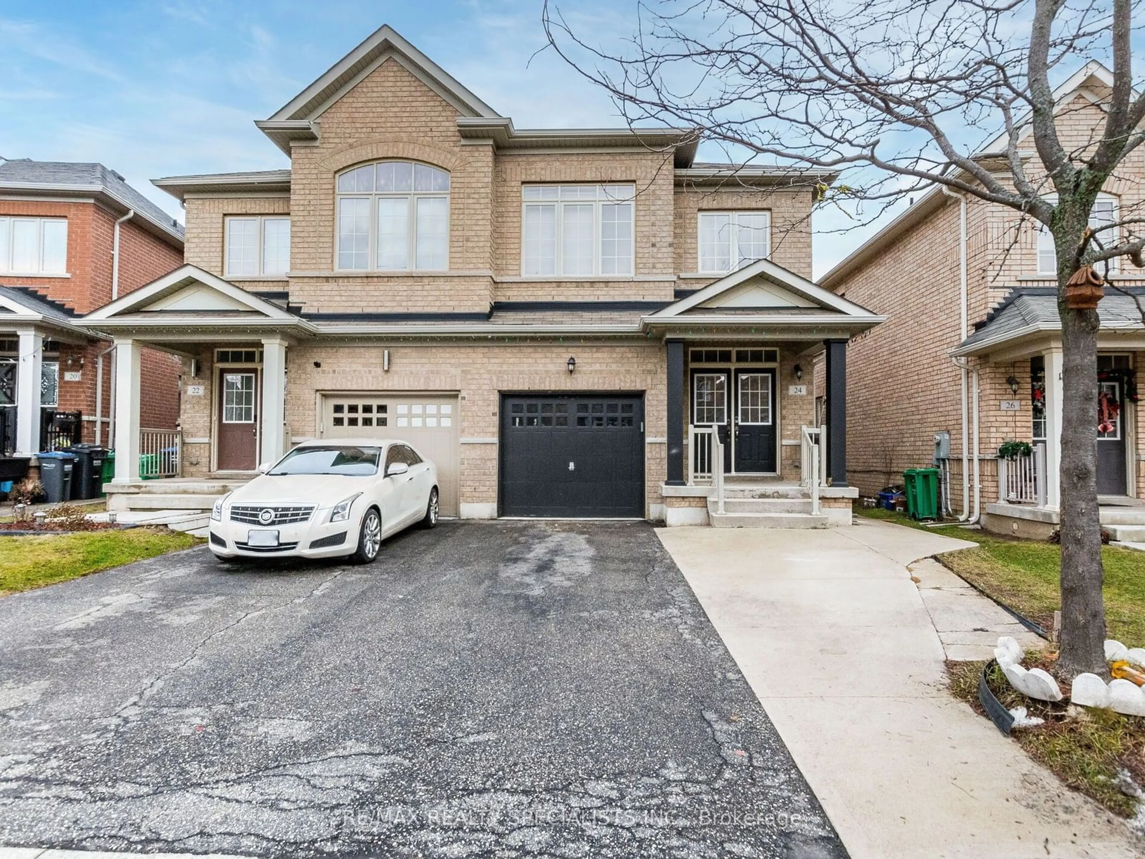 Home with brick exterior material, street for 24 Orangeblossom Tr, Brampton Ontario L6X 3B4