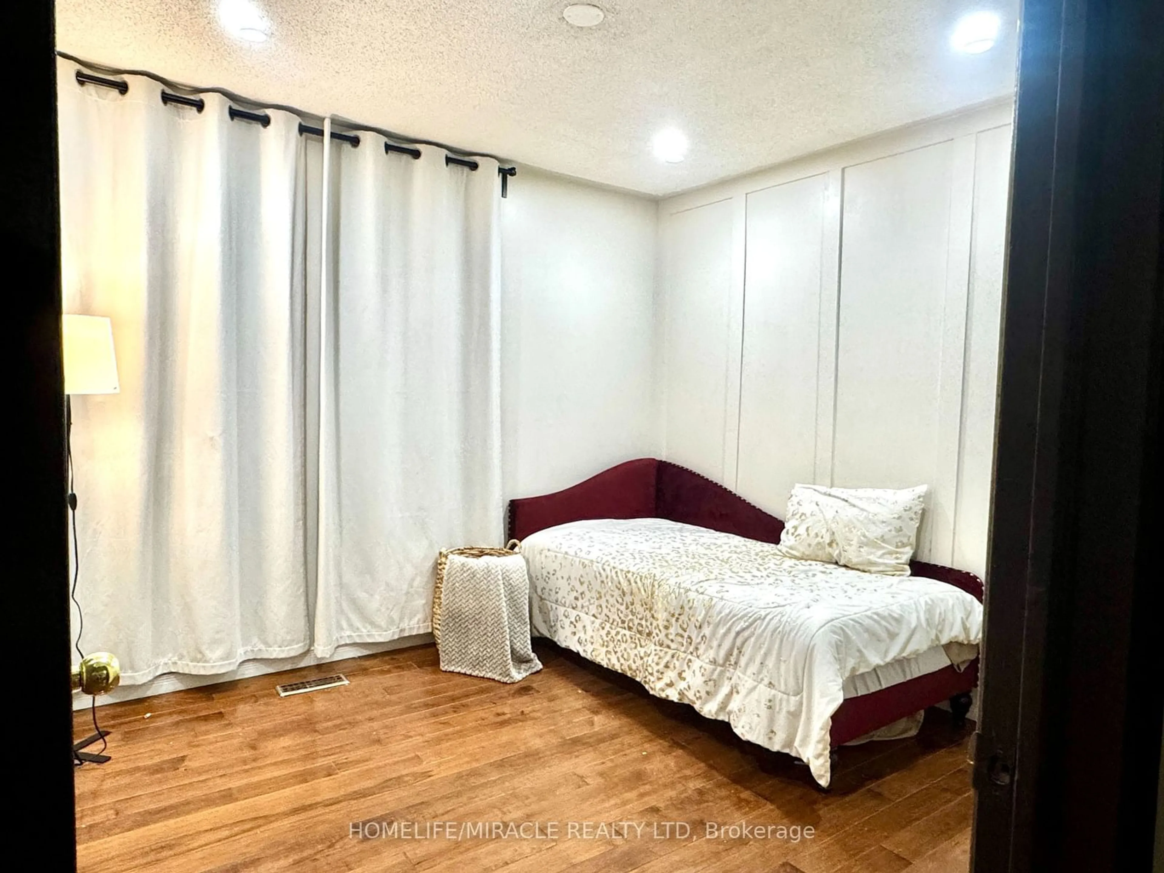 Bedroom with bed, wood/laminate floor for 22 Cranberry Cres, Brampton Ontario L6Y 4P7