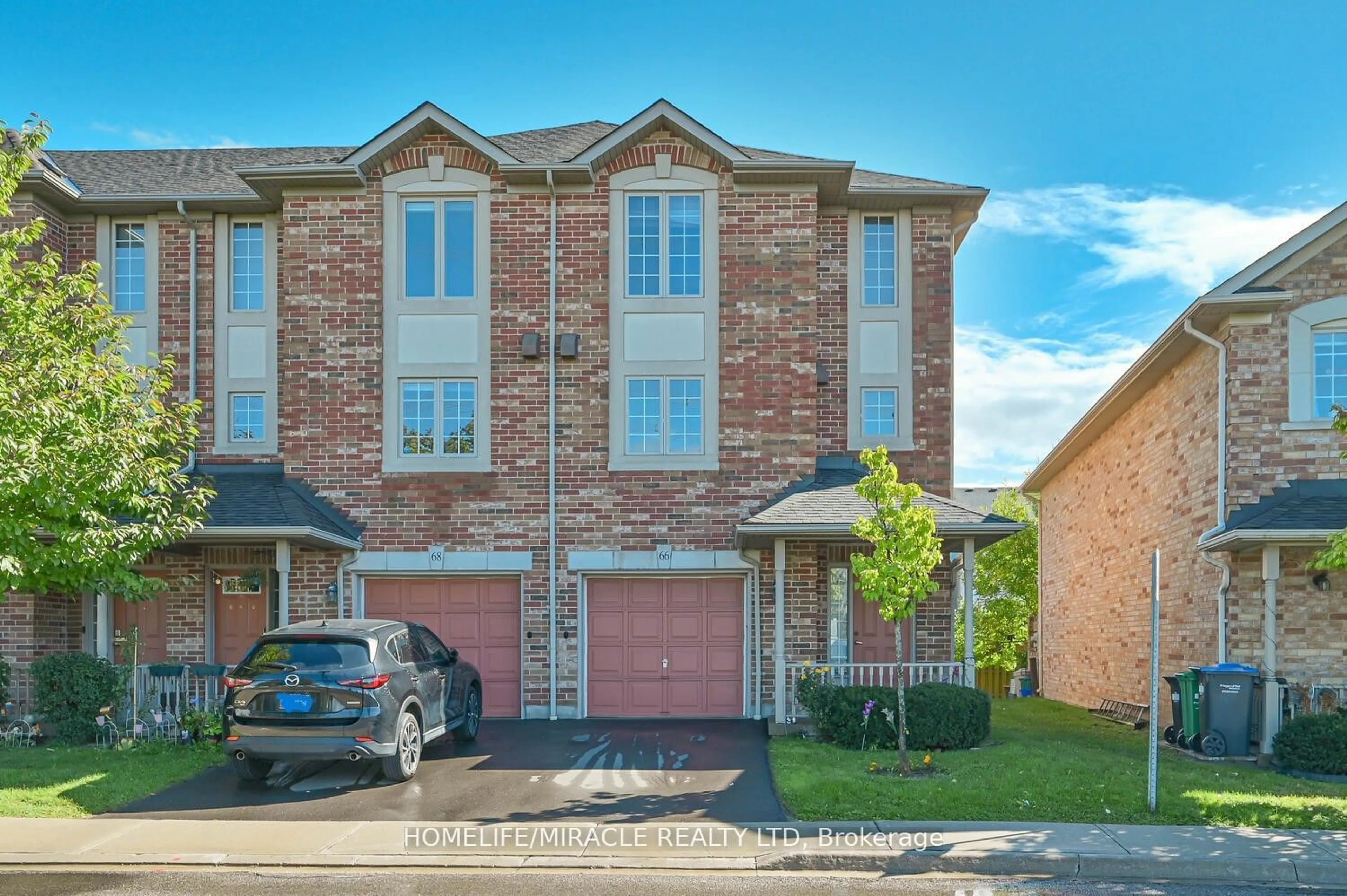 Home with brick exterior material, street for 7385 Magistrate Terr #66, Mississauga Ontario L5W 1W9