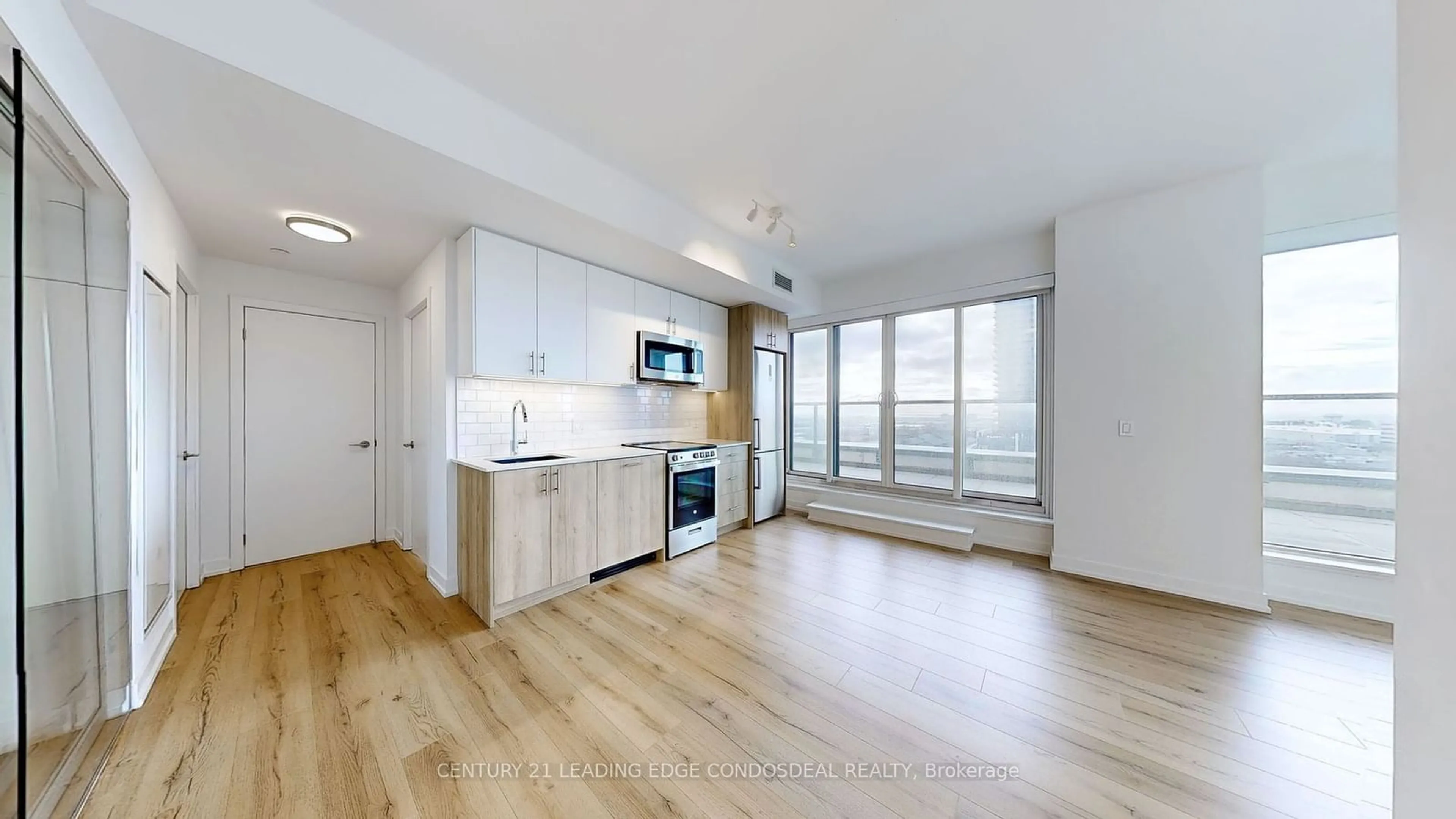 Open concept kitchen, wood/laminate floor for 1195 The Queensway St #908, Toronto Ontario M8Z 0H1