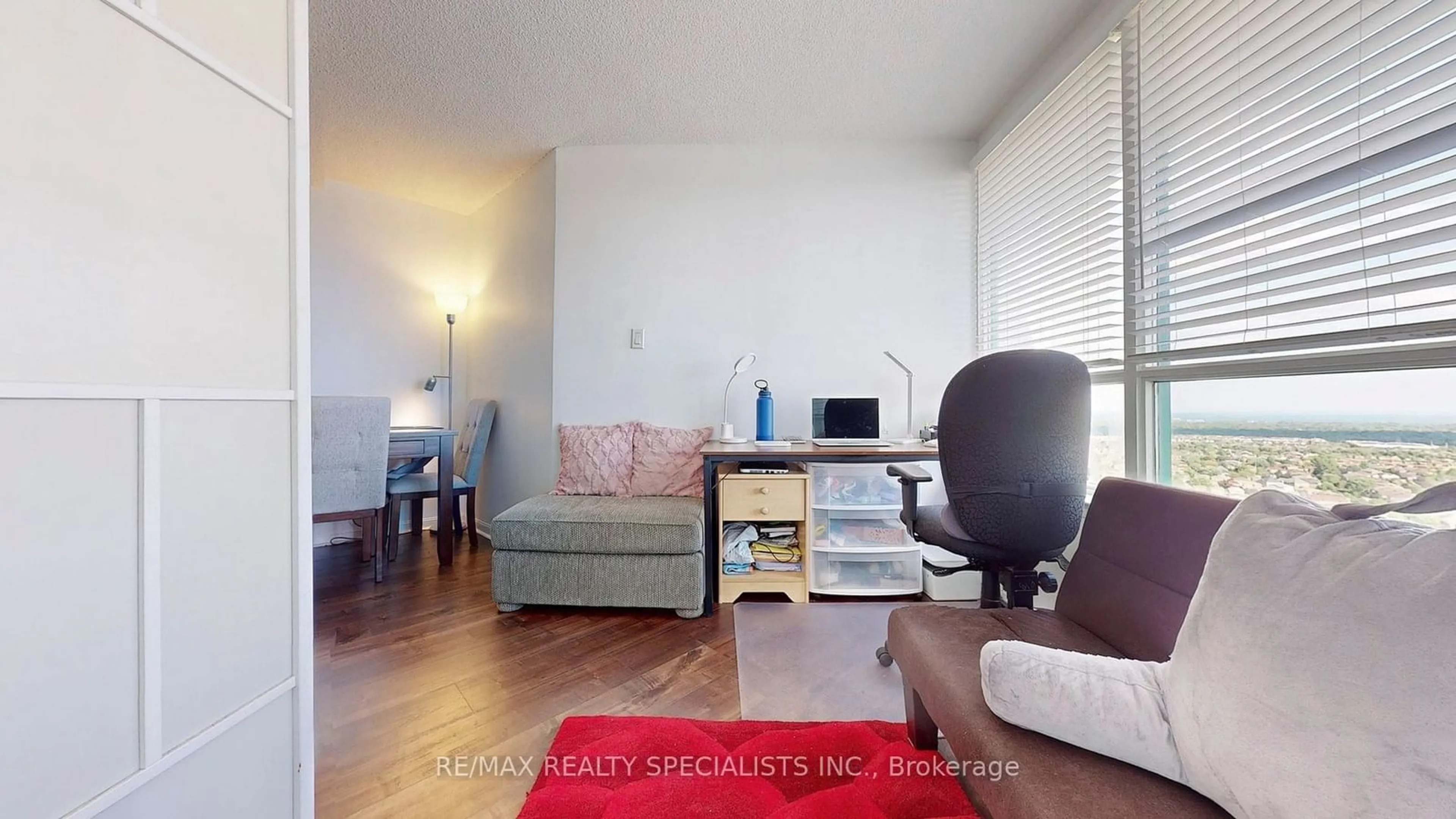 Living room with furniture, wood/laminate floor for 550 Webb Dr #2606, Mississauga Ontario L5B 3Y4