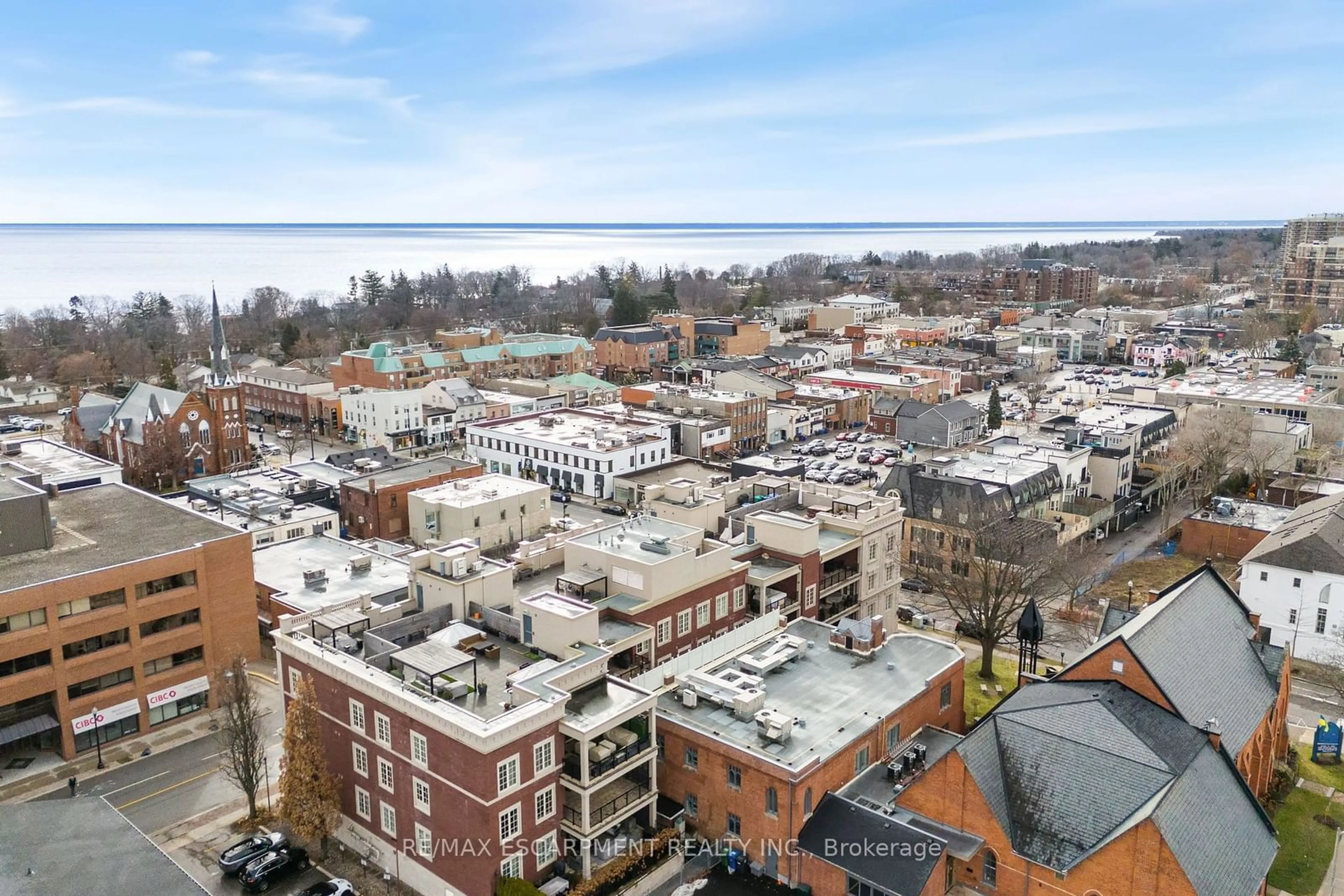 A pic from outside/outdoor area/front of a property/back of a property/a pic from drone, city buildings view from balcony for 253 Church St #302, Oakville Ontario L6J 1N7