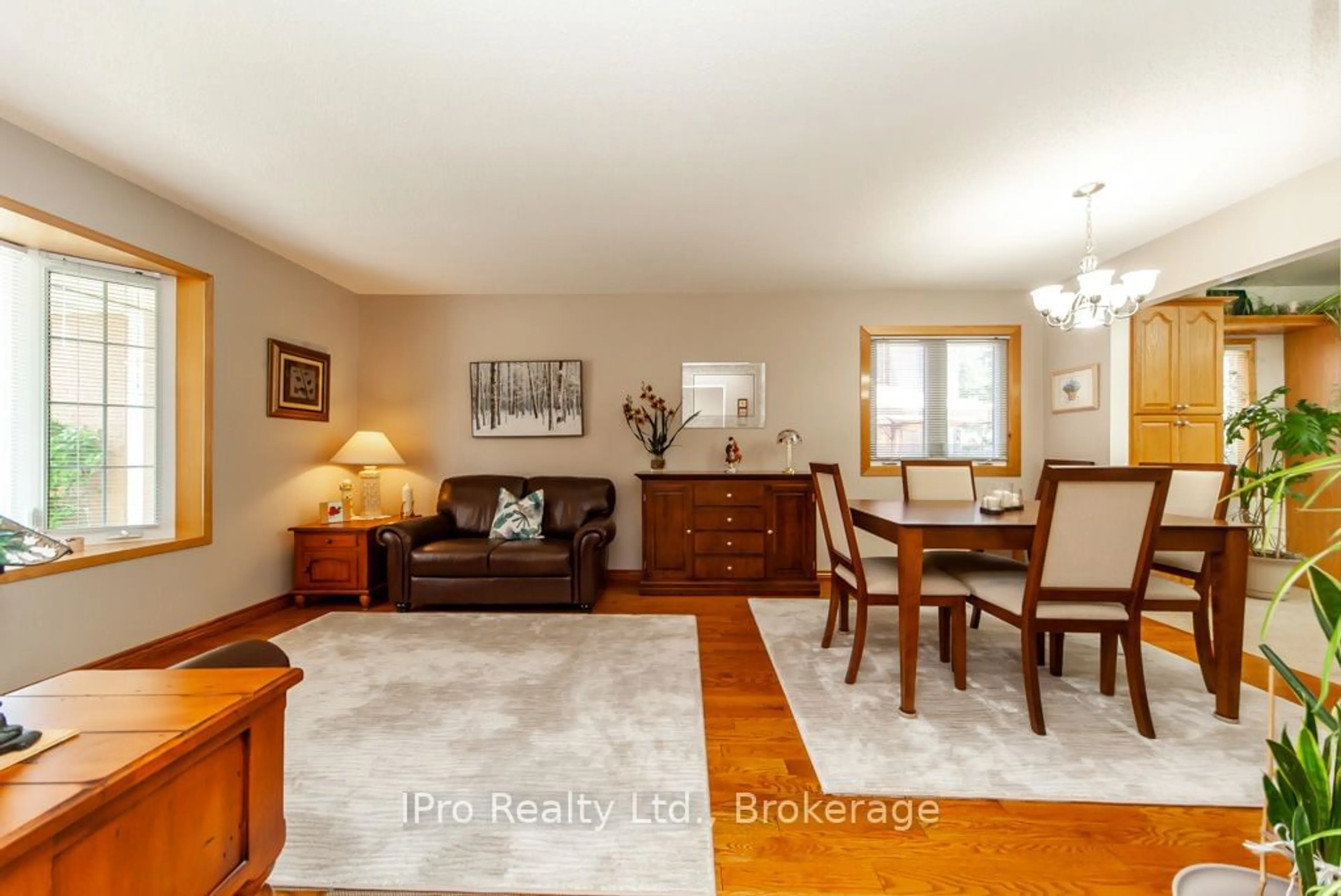 Living room with furniture, wood/laminate floor for 847 Cedarbrae Ave, Milton Ontario L9T 3W9