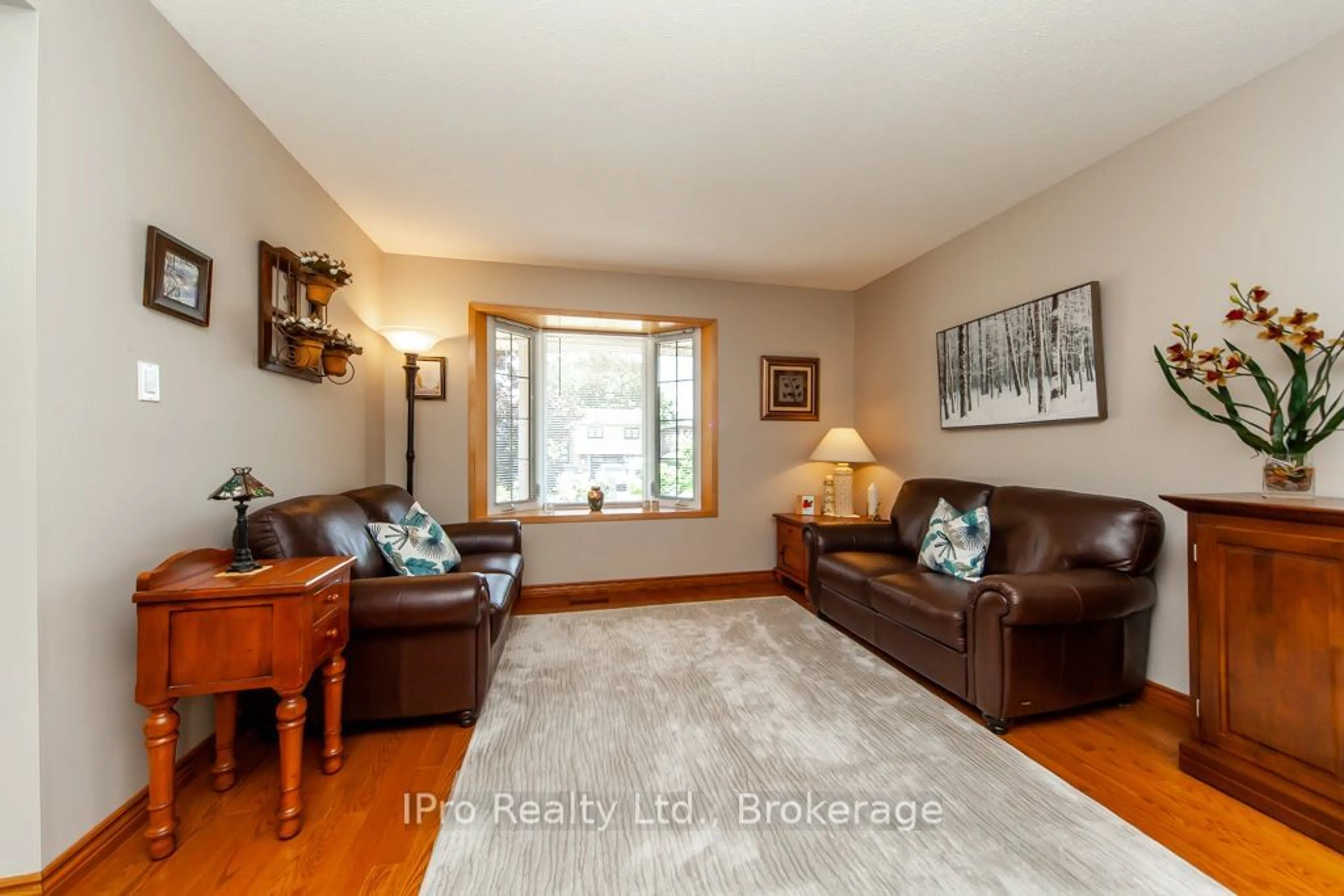 Living room with furniture, wood/laminate floor for 847 Cedarbrae Ave, Milton Ontario L9T 3W9