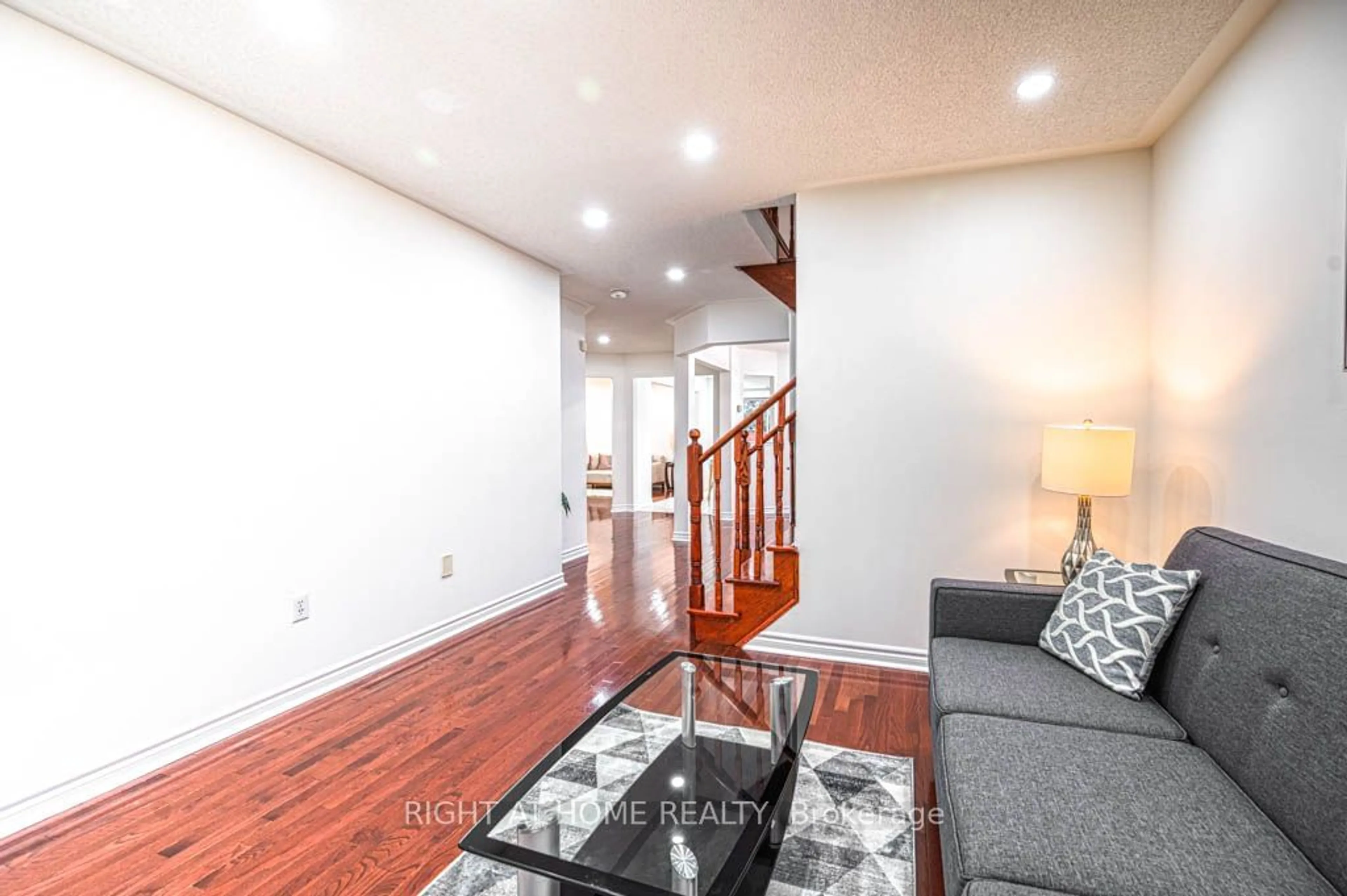 Living room with furniture, wood/laminate floor for 7 Gabrielle Dr, Brampton Ontario L7A 2A3