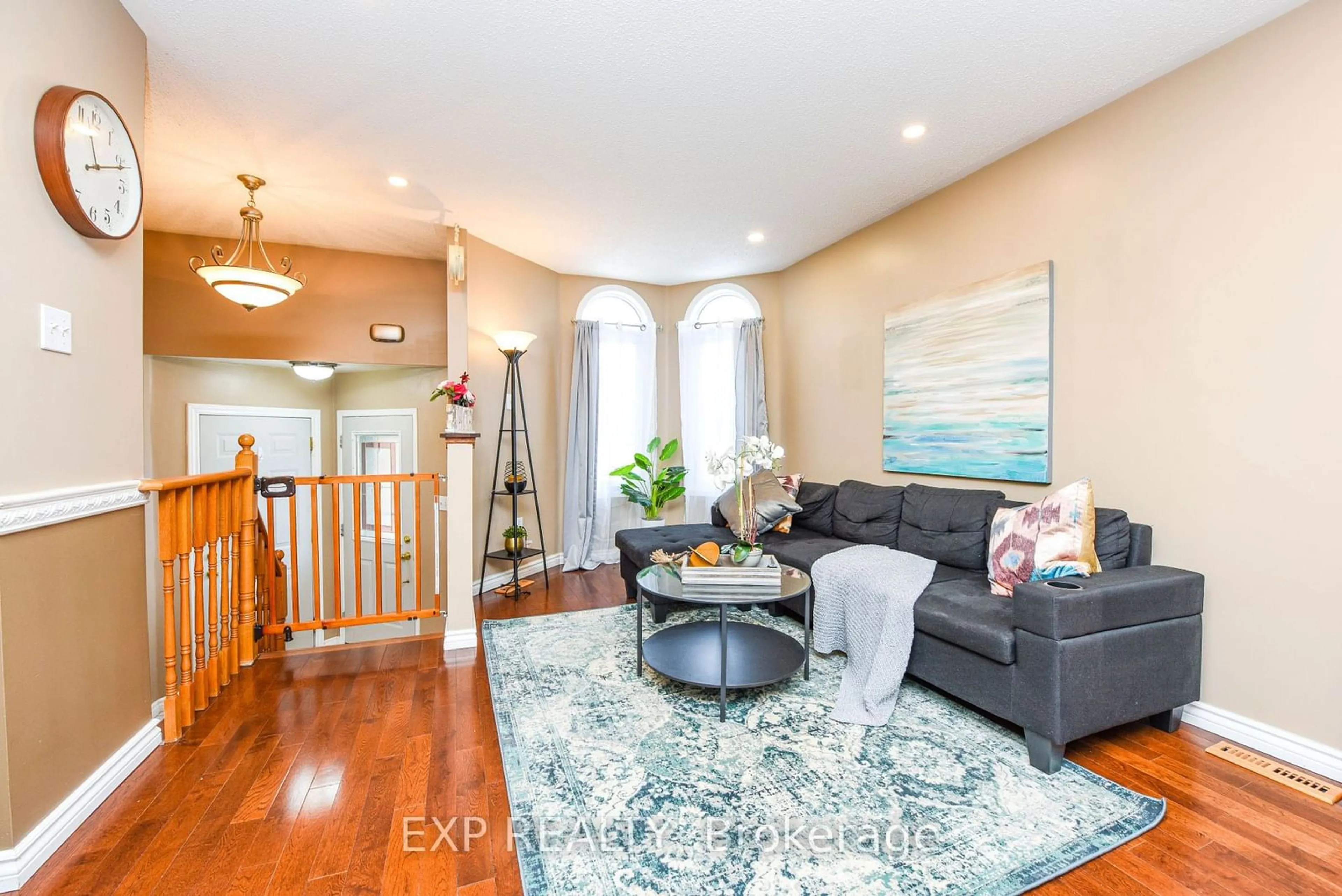 Living room with furniture, wood/laminate floor for 35 Royal Orchard Dr, Brampton Ontario L6X 4M6