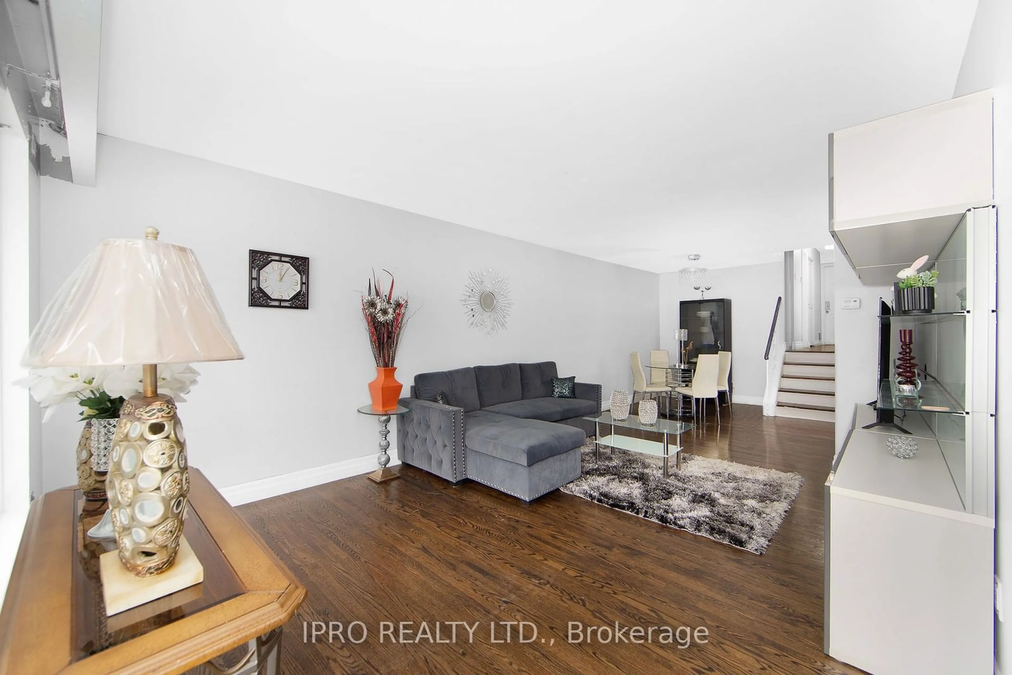 Living room with furniture, wood/laminate floor for 104 Topcliff Ave, Toronto Ontario M3N 1L8