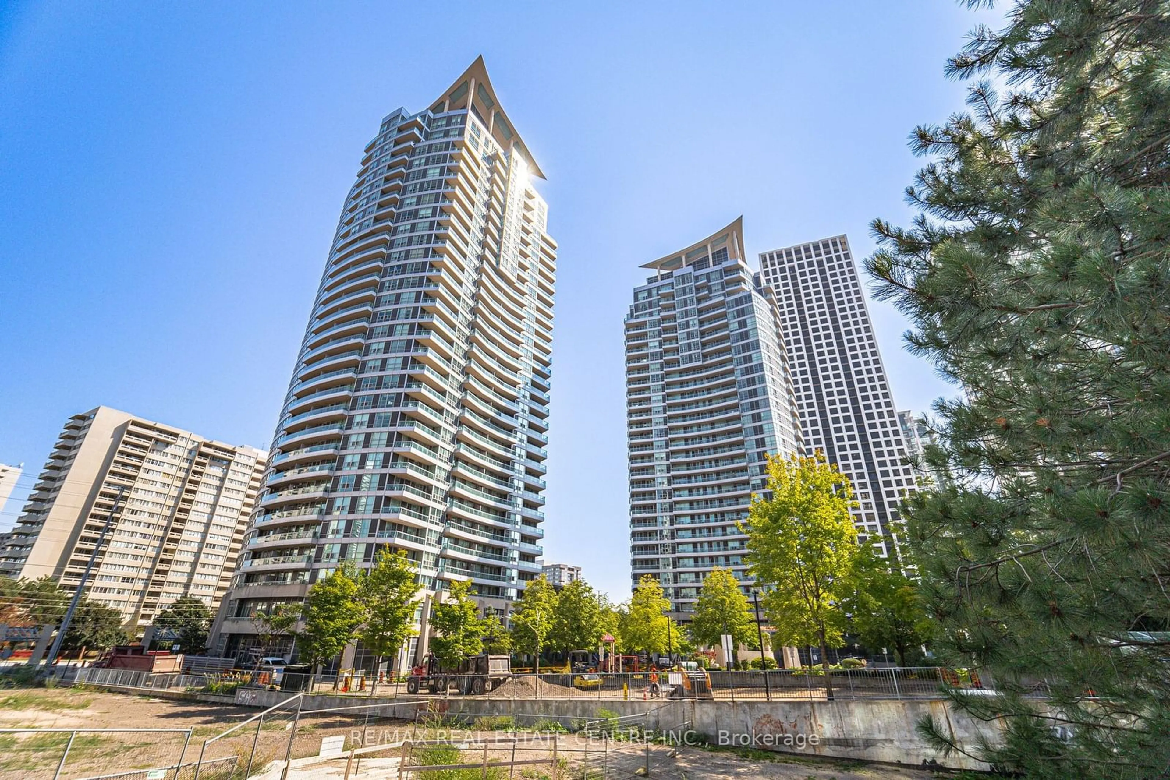 Patio, city buildings view from balcony for 33 Elm Dr #105, Mississauga Ontario L5B 4M2