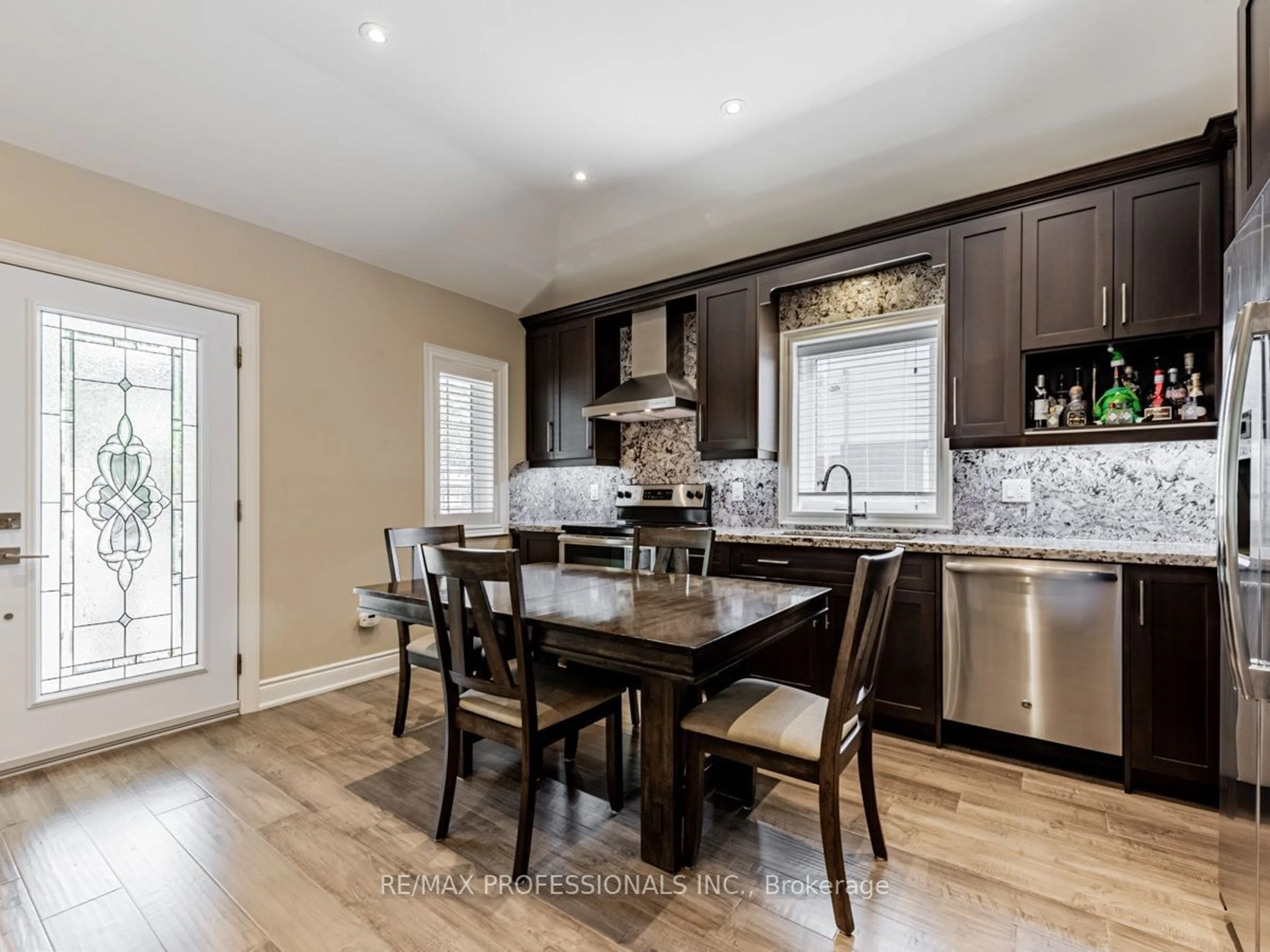 Open concept kitchen, wood/laminate floor for 16 Lockerbie Ave, Toronto Ontario M9N 3A1