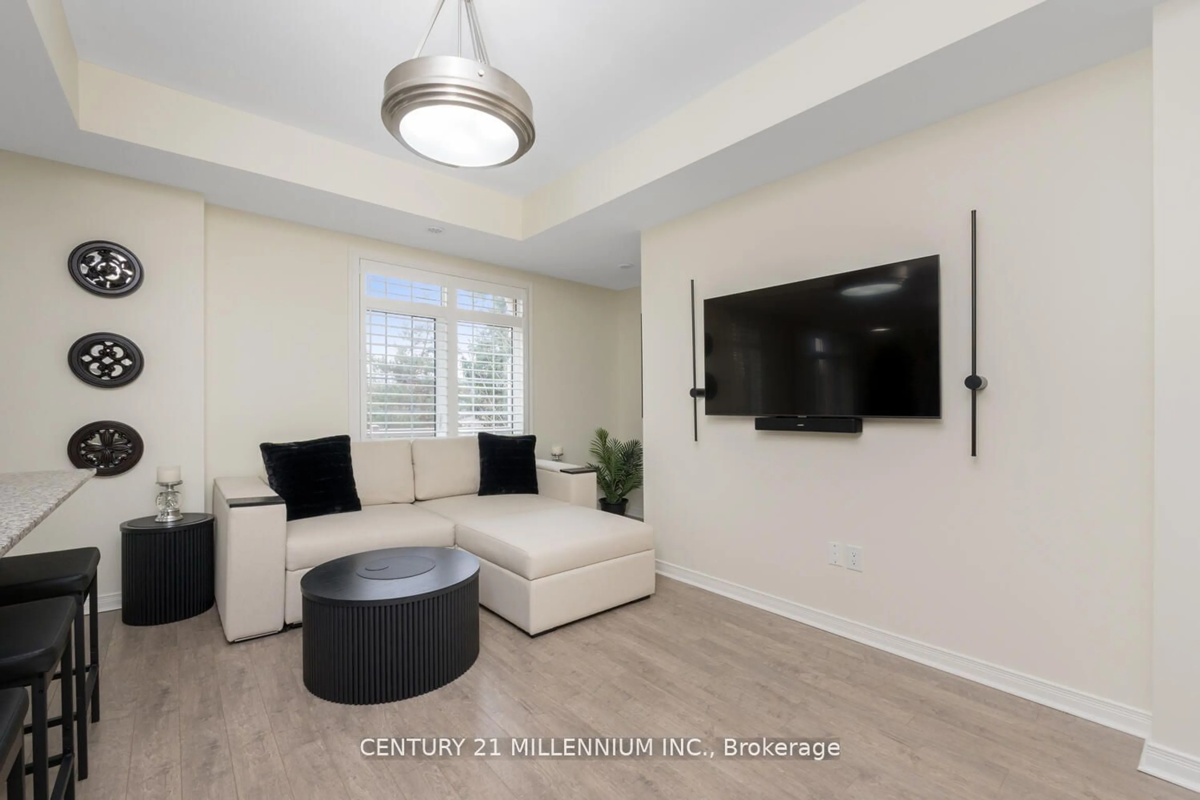 Living room with furniture, wood/laminate floor for 180 Howden Blvd #51, Brampton Ontario L6S 0E6