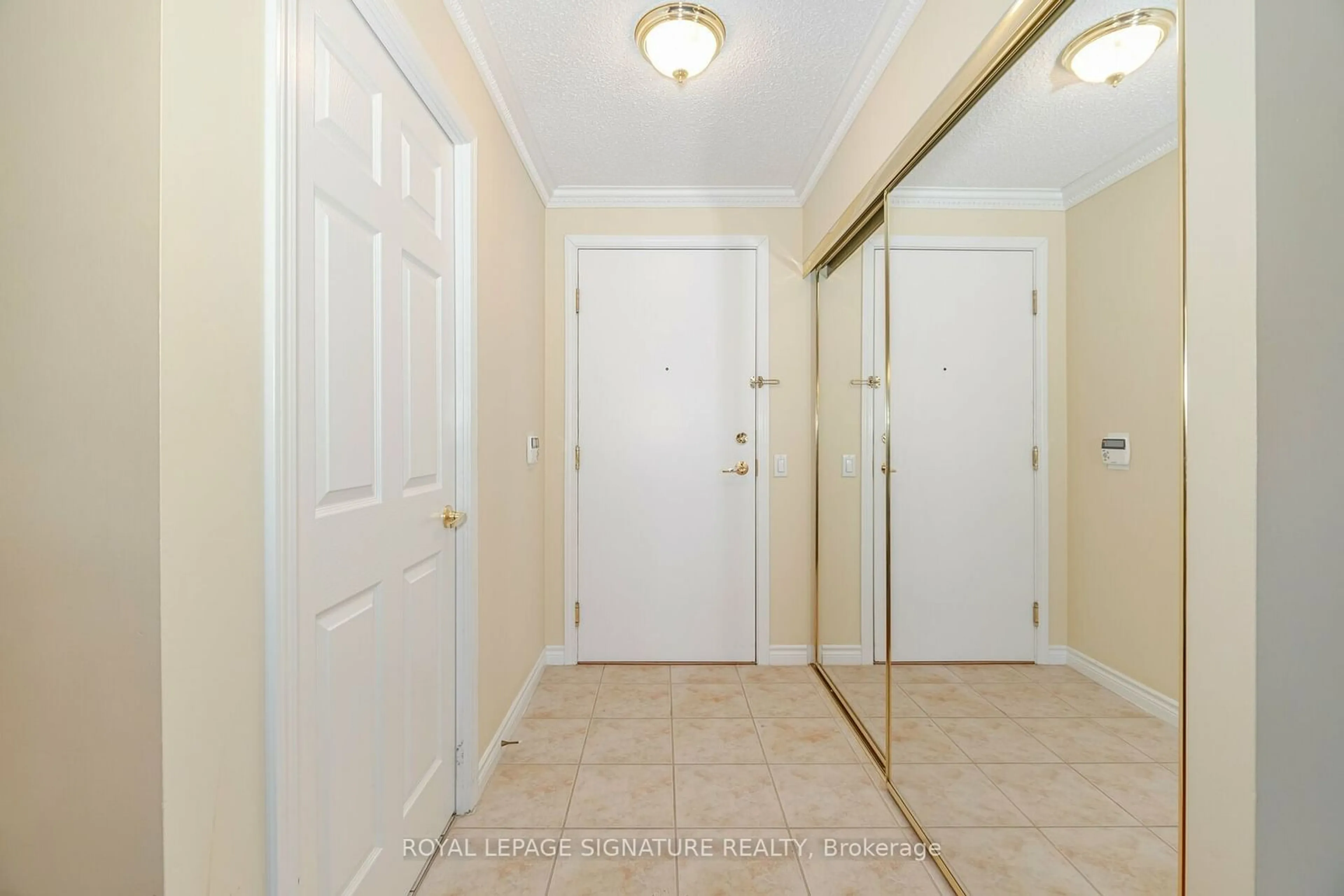 Indoor entryway for 35 Kingsbridge Garden Circ #1705, Mississauga Ontario L5R 3Z5