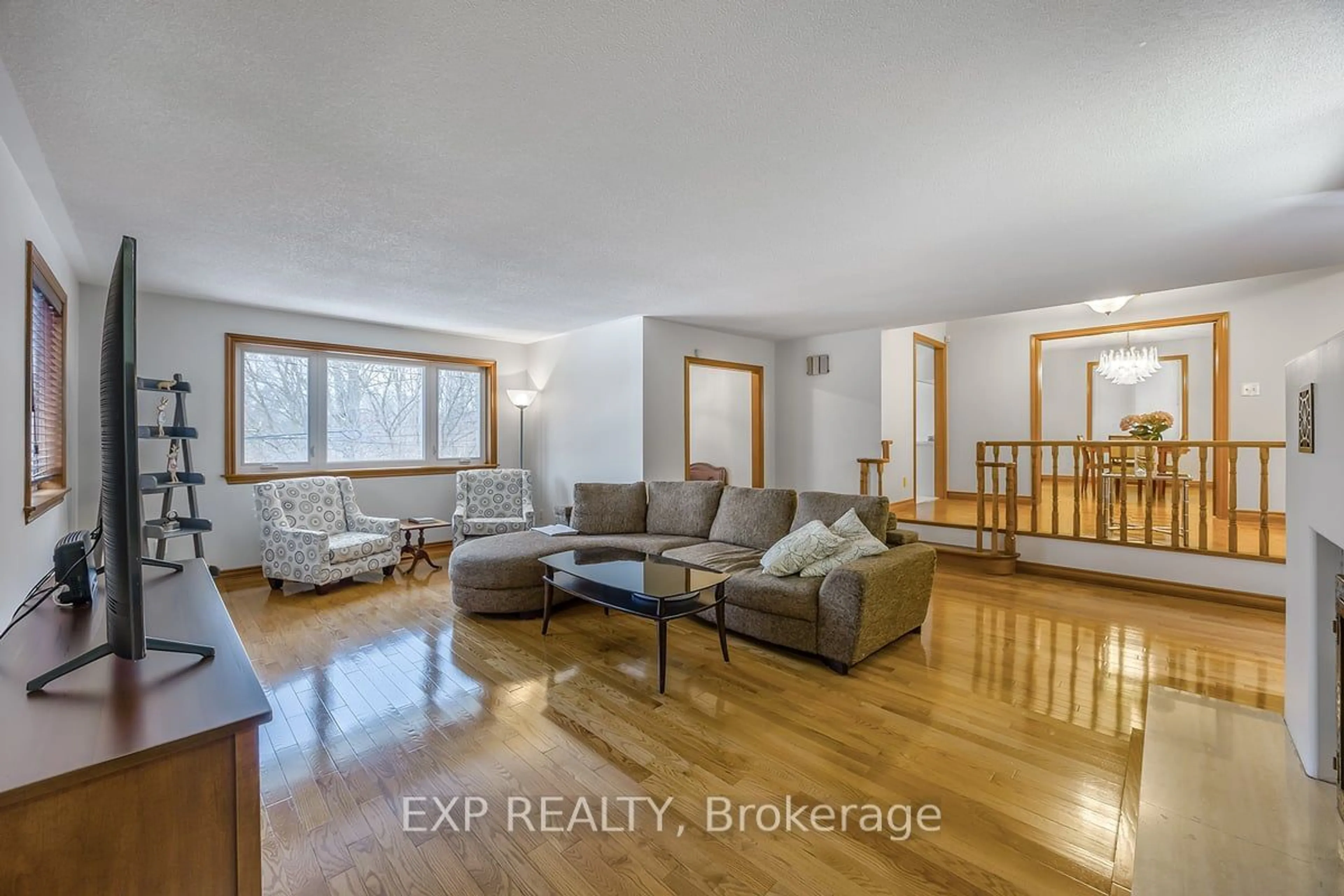 Living room with furniture, wood/laminate floor for 63 Riverside Dr, Toronto Ontario M9L 1J2