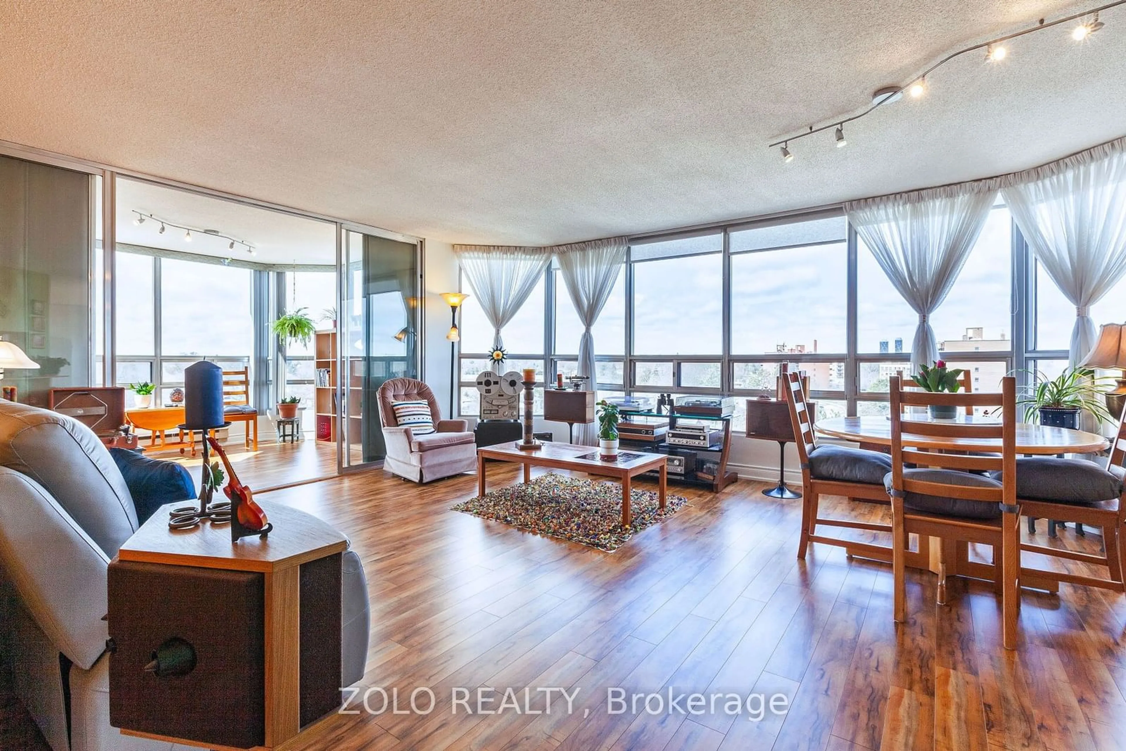 Living room with furniture, wood/laminate floor for 310 Mill St #709, Brampton Ontario L6Y 3B1