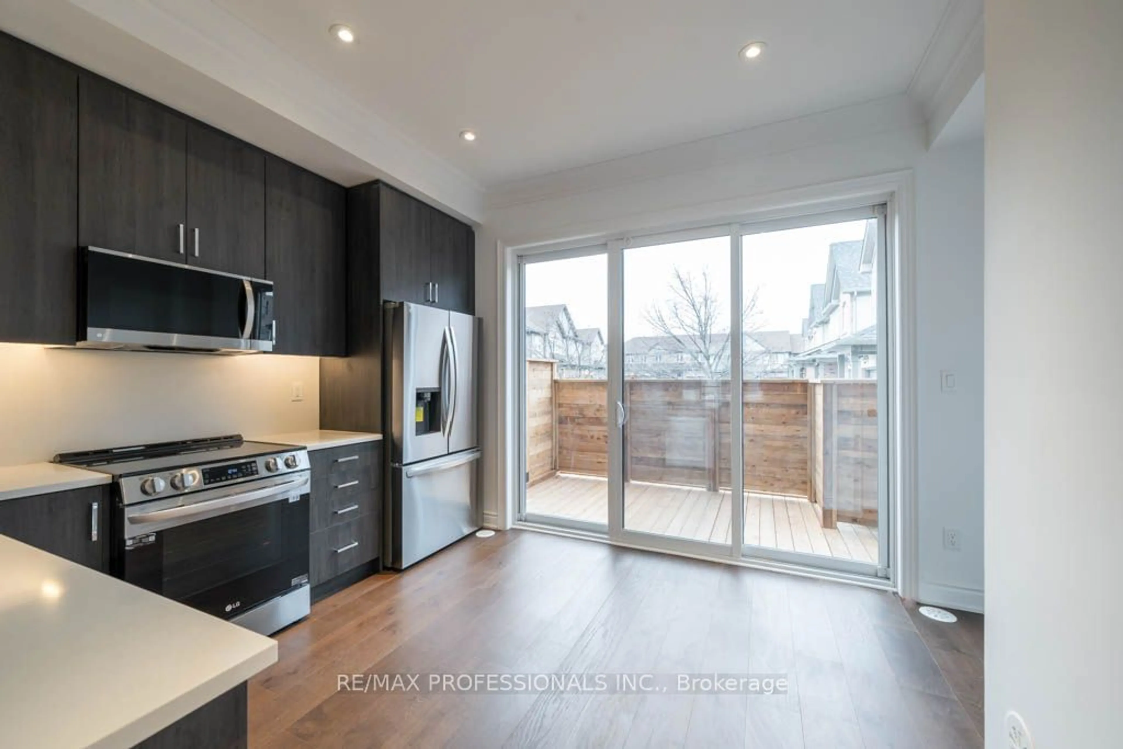 Open concept kitchen, wood/laminate floor for 56 Lunar Cres #171, Mississauga Ontario L5M 2R5