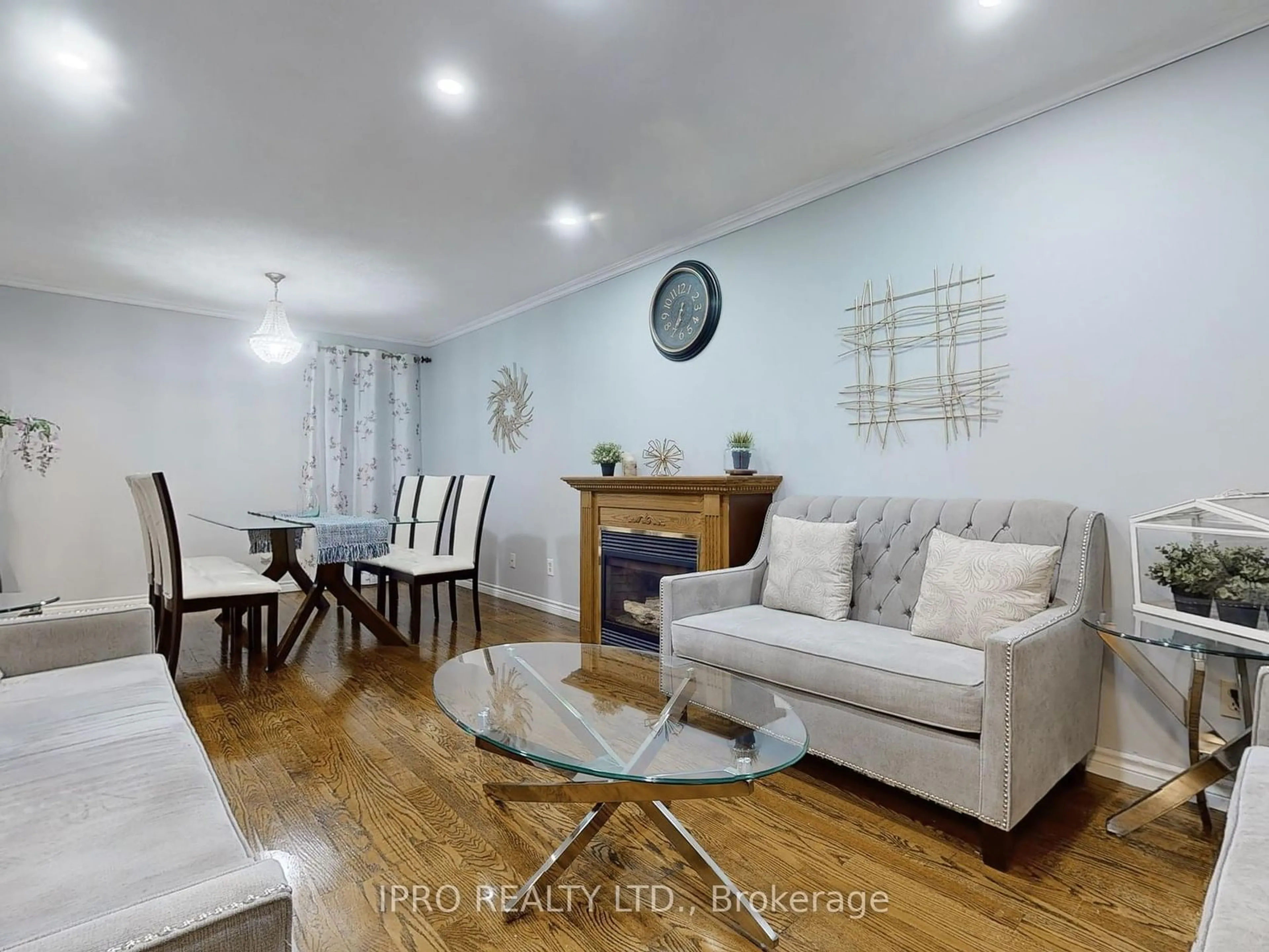 Living room with furniture, wood/laminate floor for 4387 Violet Rd, Mississauga Ontario L5V 1J8