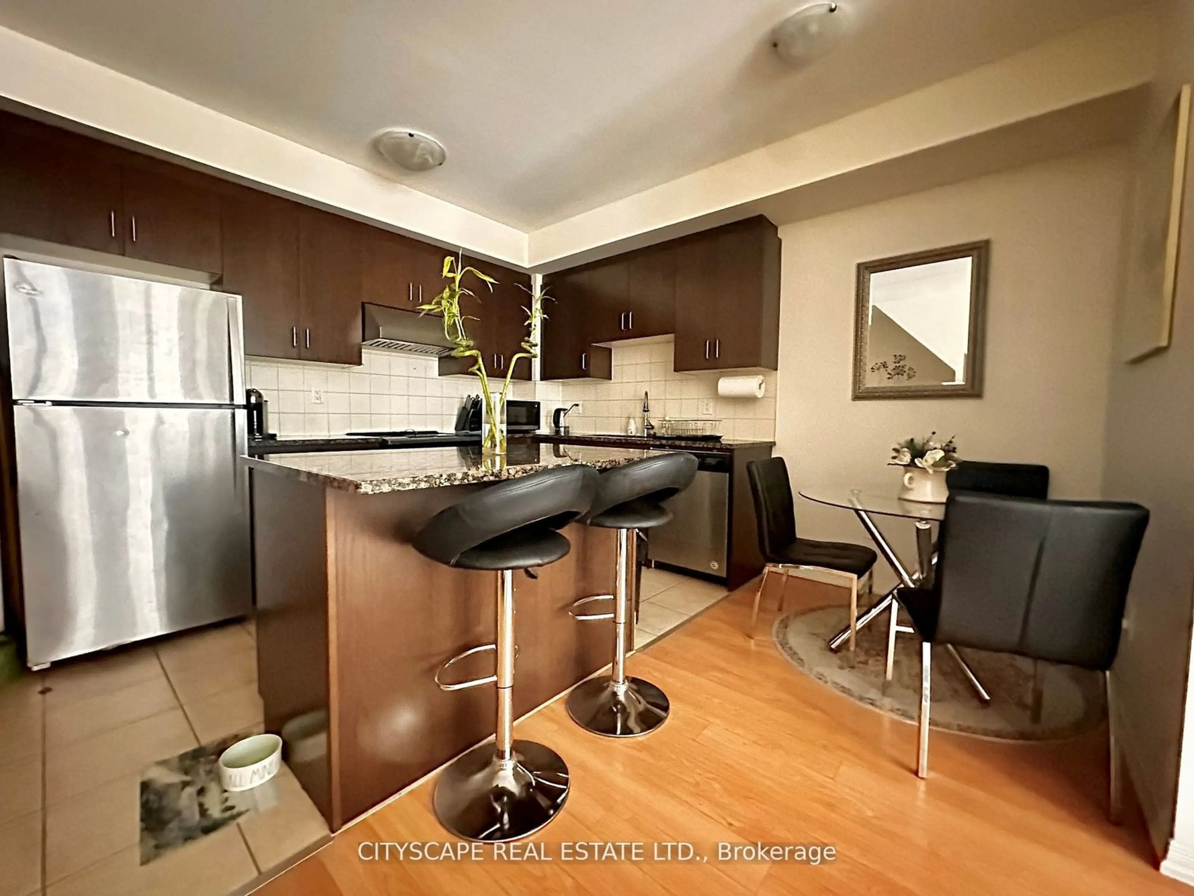 Open concept kitchen, wood/laminate floor for 11 Applewood Lane #114, Toronto Ontario M9C 2Z7