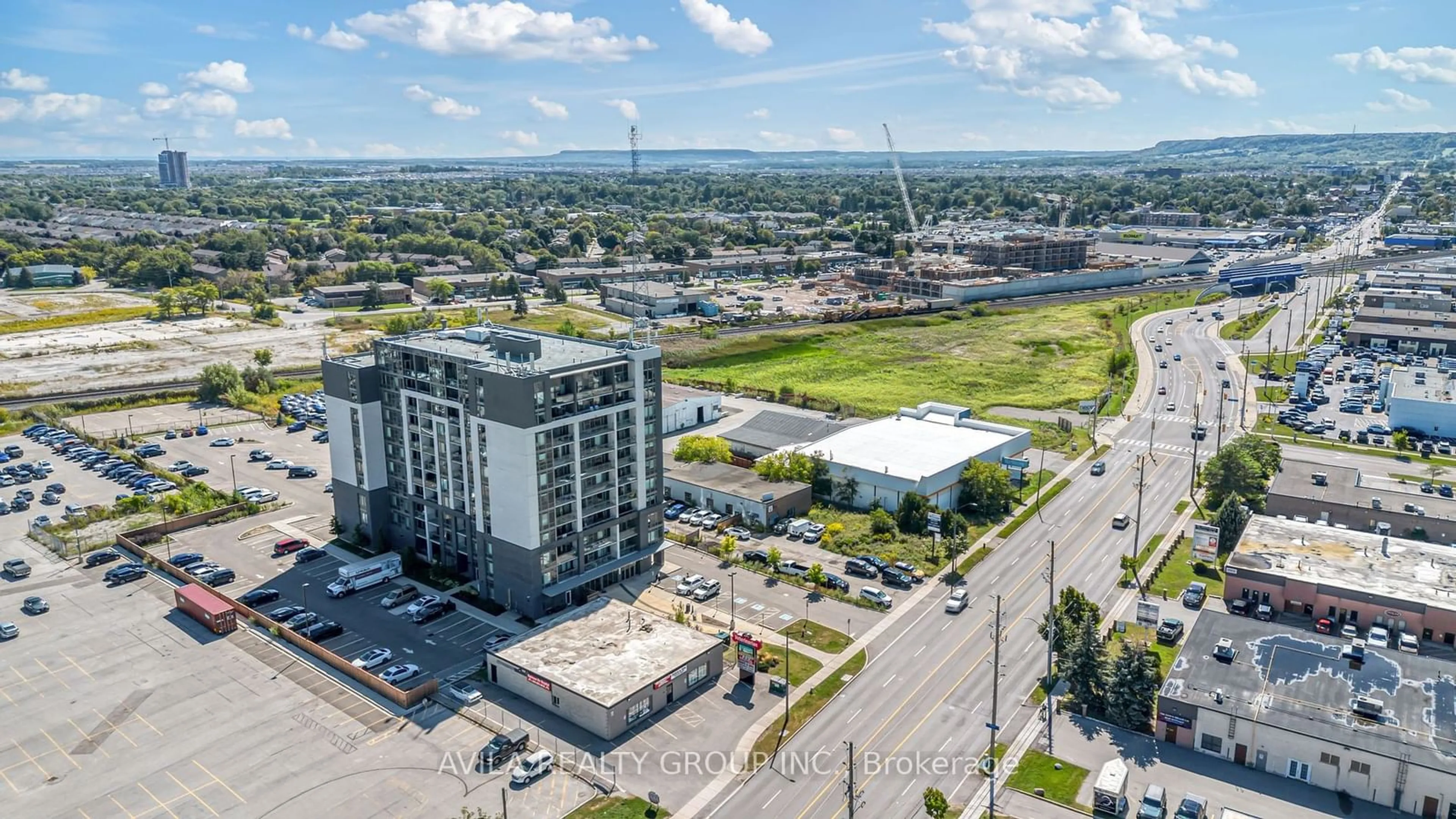 A pic from outside/outdoor area/front of a property/back of a property/a pic from drone, unknown for 716 Main St #102, Milton Ontario L9T 3P6