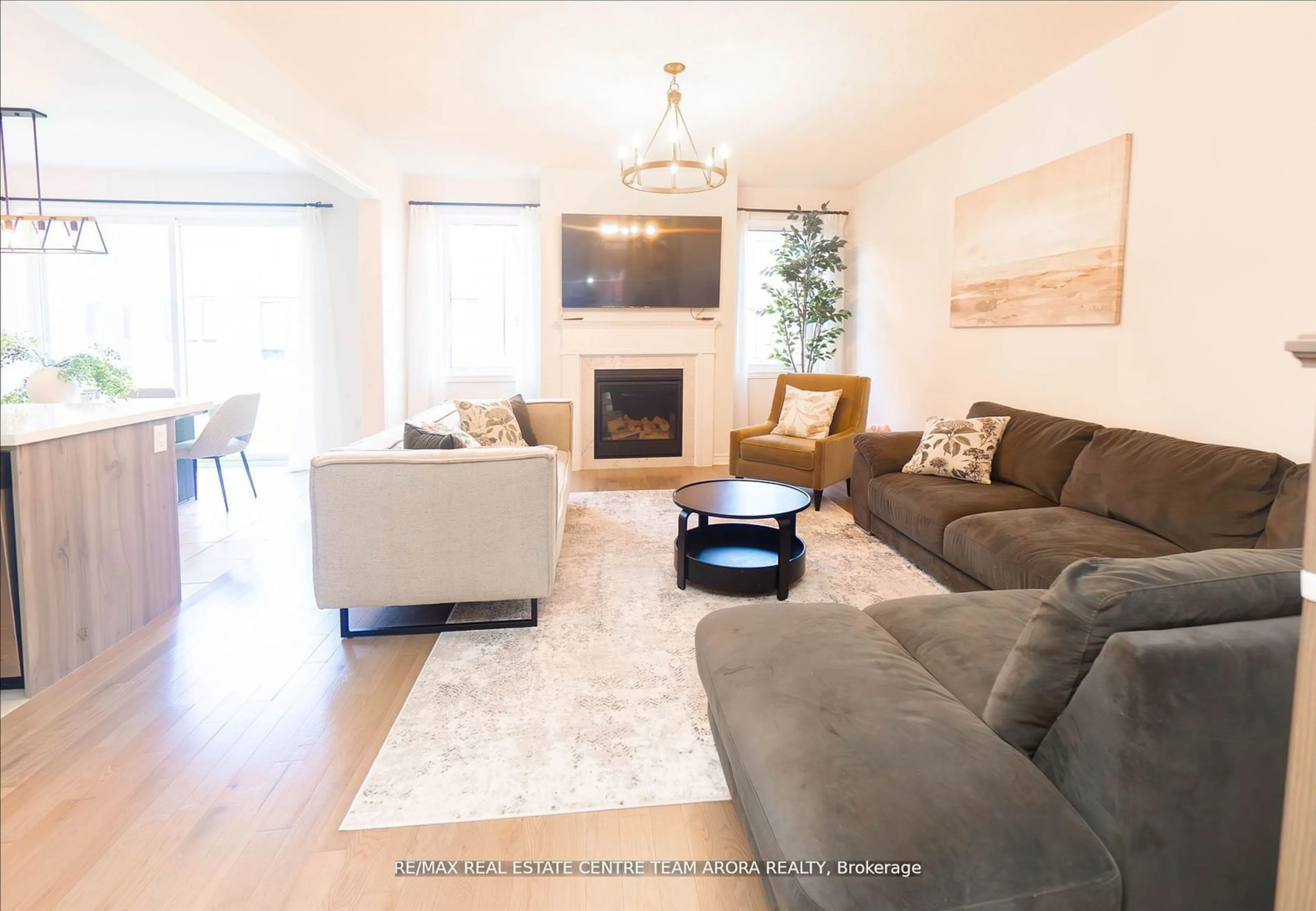 Living room with furniture, wood/laminate floor for 115 Petch Ave, Caledon Ontario L7C 4K3