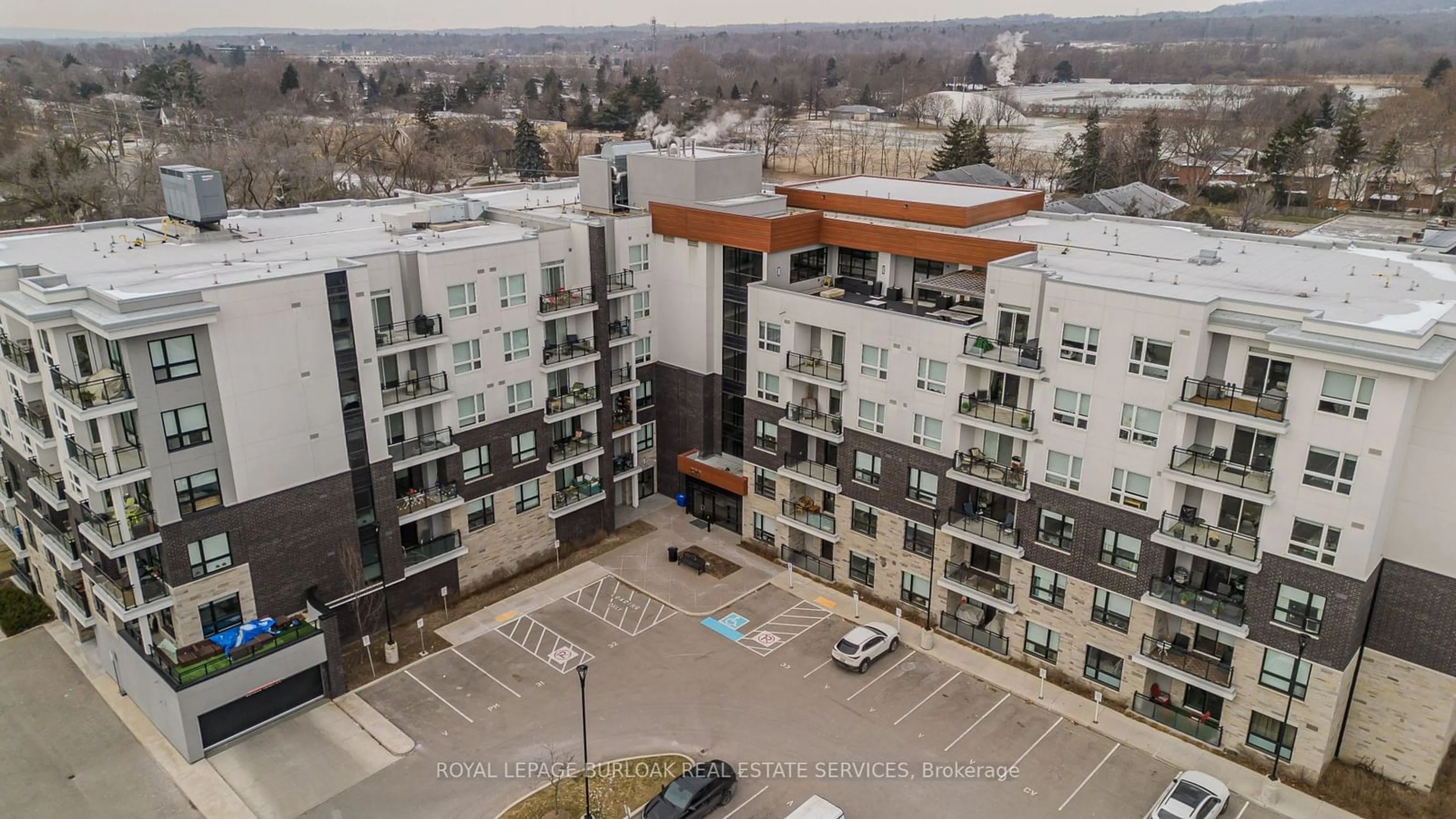 A pic from outside/outdoor area/front of a property/back of a property/a pic from drone, city buildings view from balcony for 320 Plains Rd #517, Burlington Ontario L7T 0C1