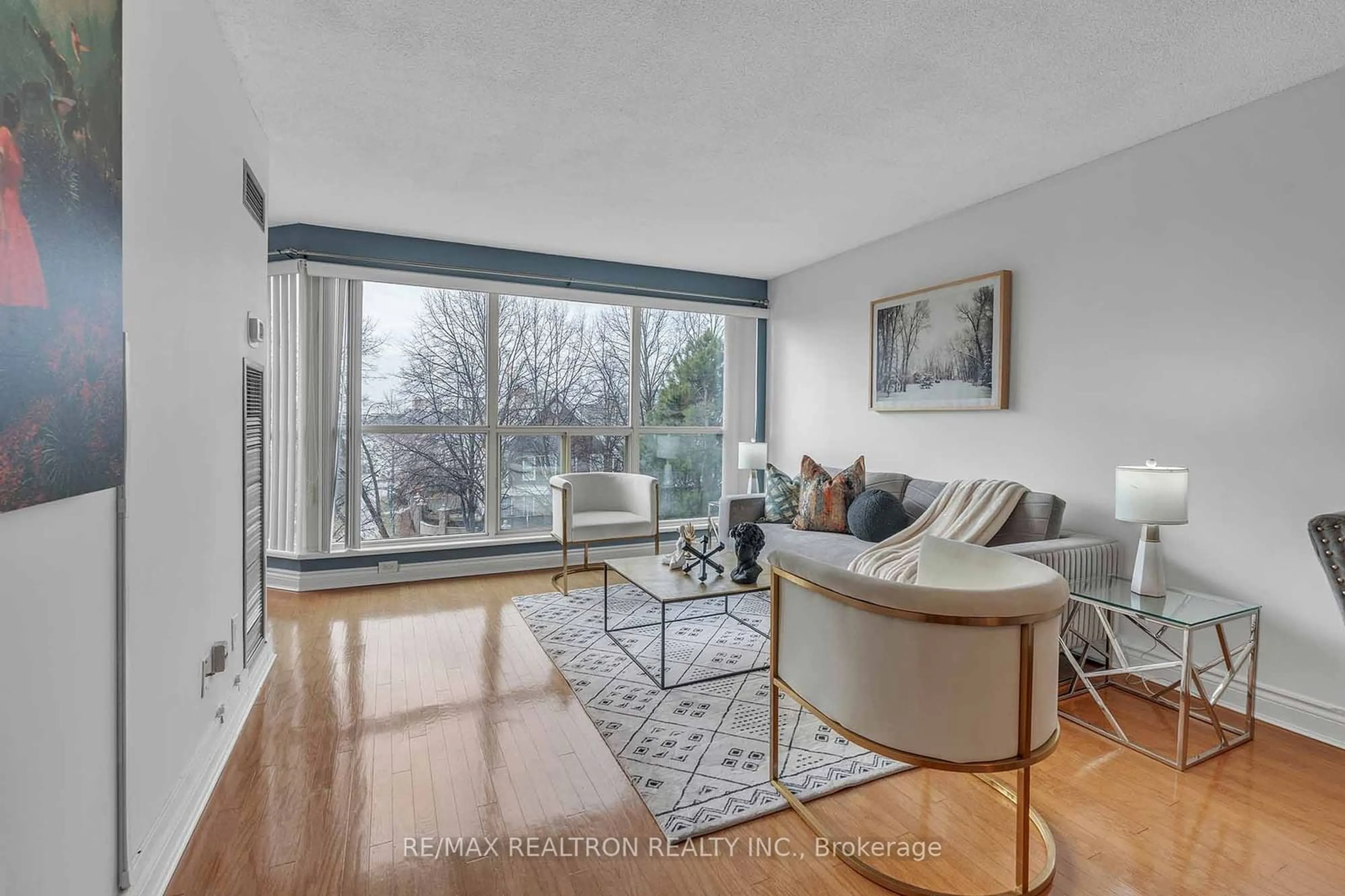 Living room with furniture, wood/laminate floor for 2267 Lake Shore Blvd #411, Toronto Ontario M8V 3X2