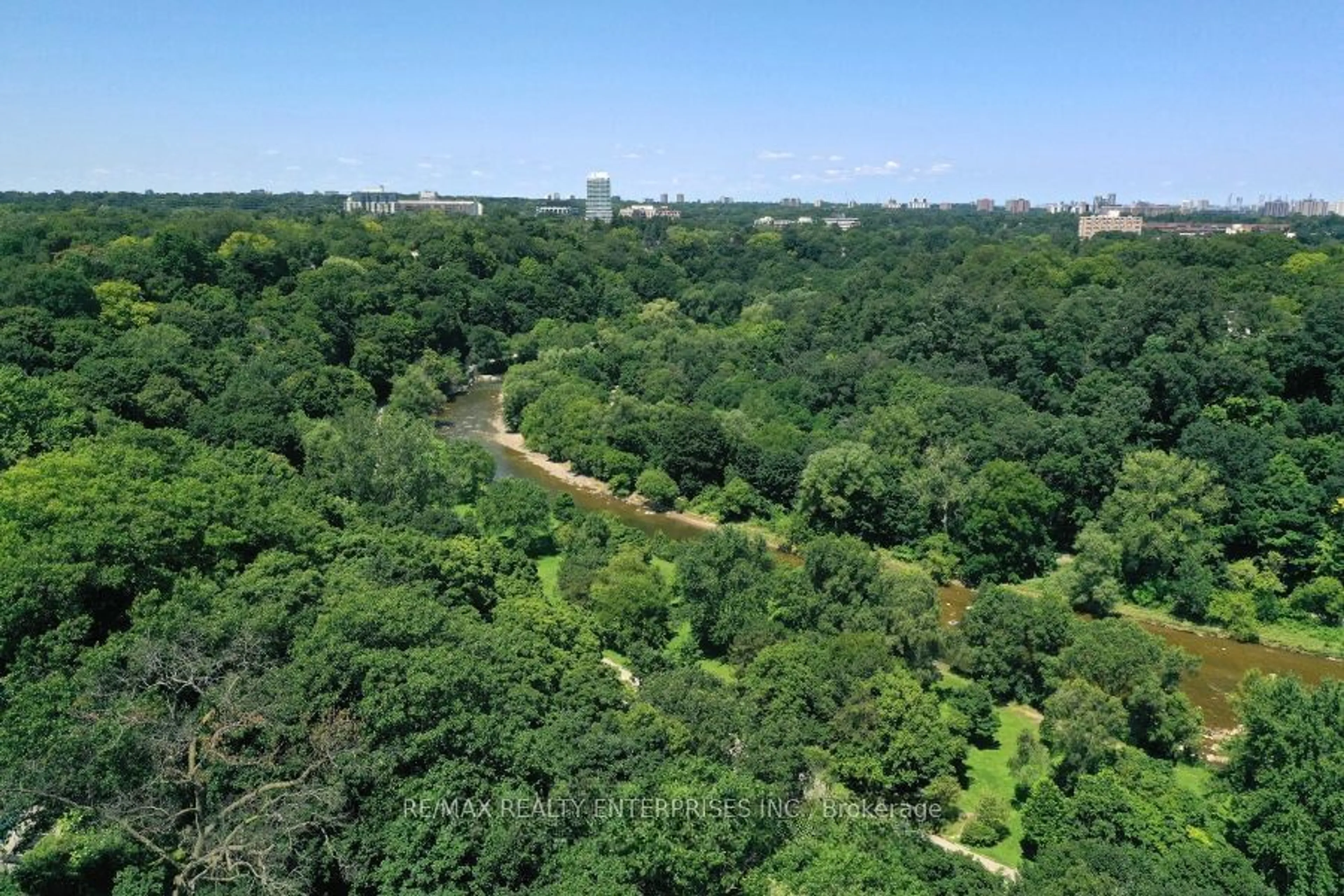 A pic from outside/outdoor area/front of a property/back of a property/a pic from drone, forest/trees view for 100 Old Mill Rd, Toronto Ontario M8X 1G8