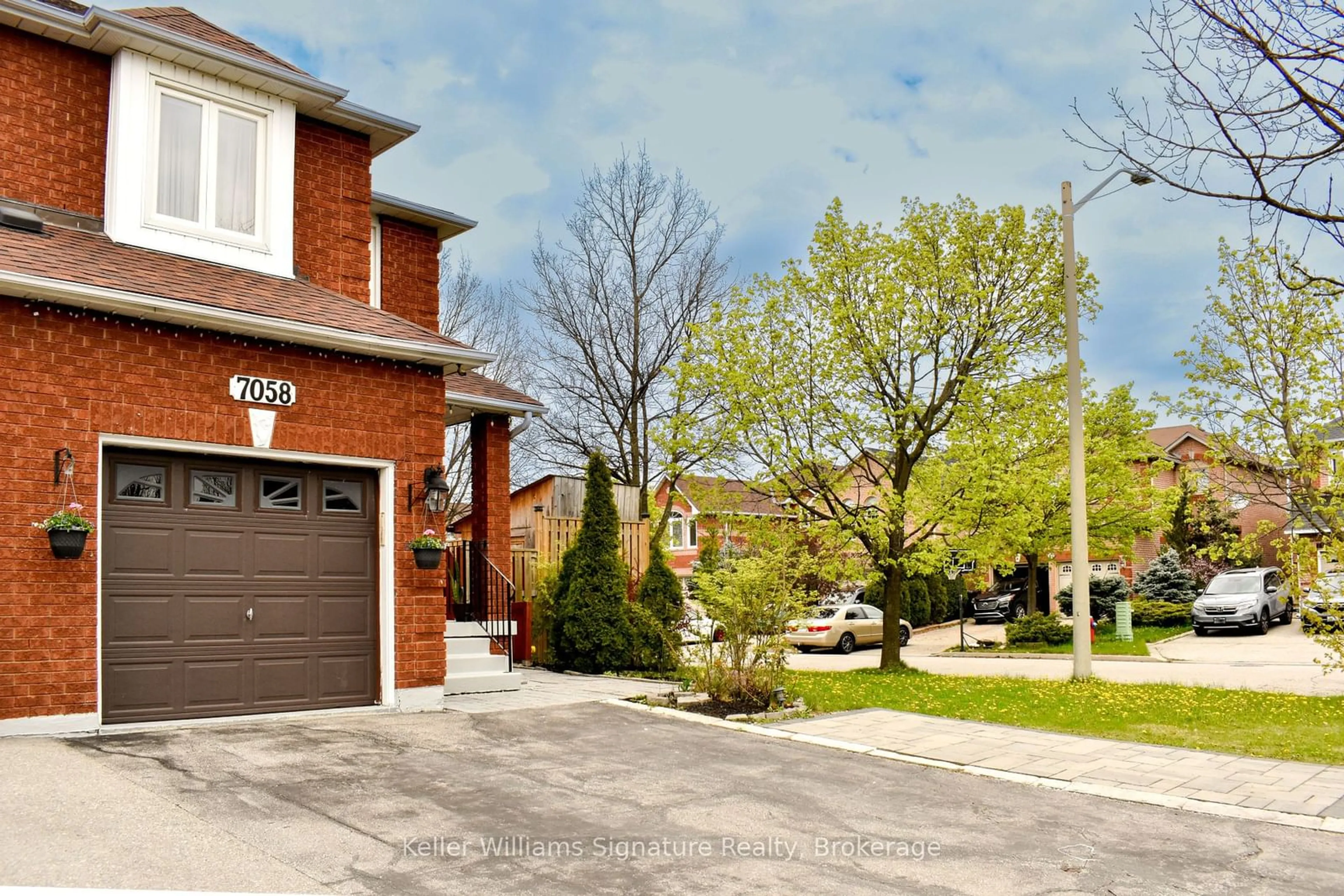 Home with brick exterior material, street for 7058 STONEYWOOD Way, Mississauga Ontario L5N 6Y5