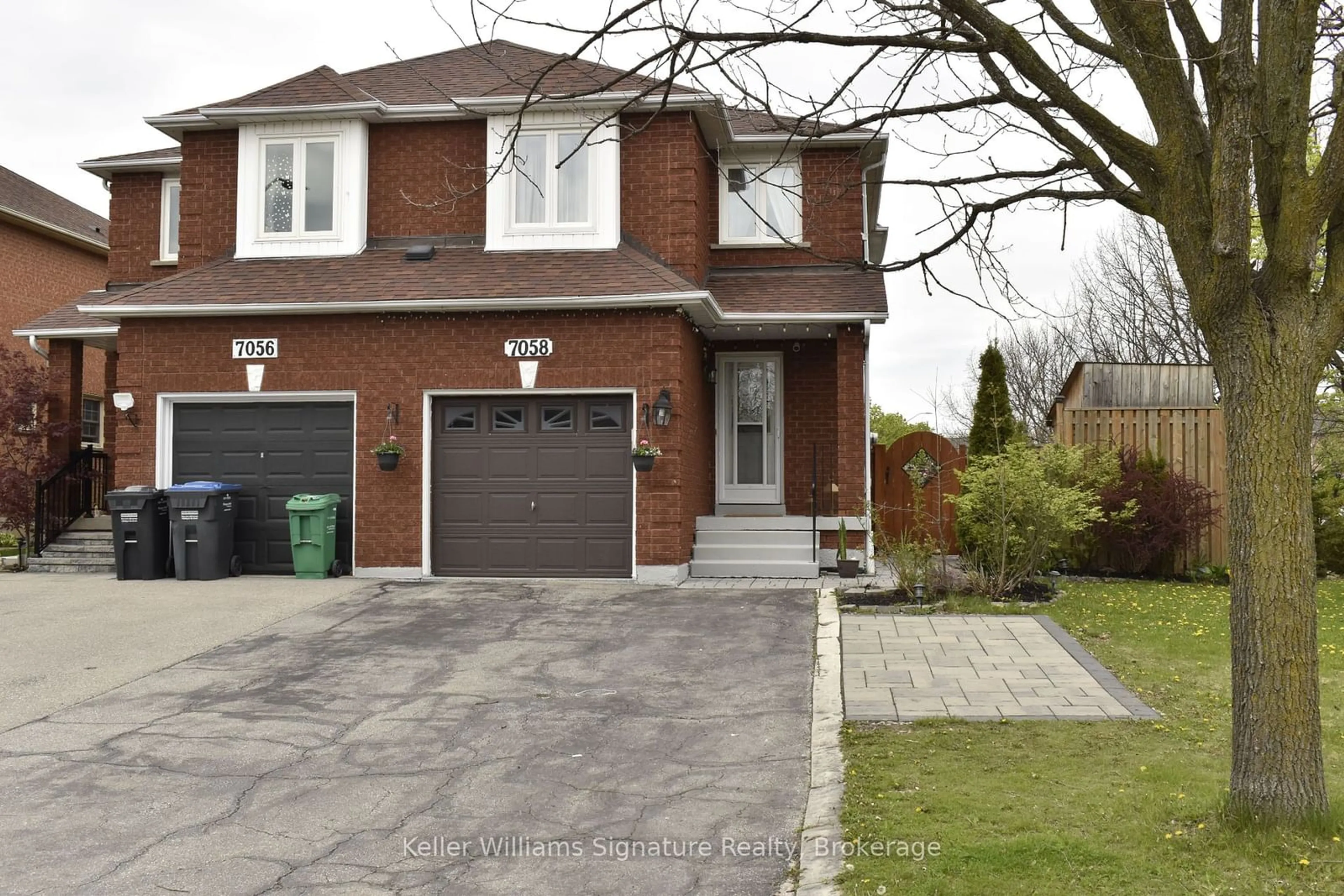 Home with brick exterior material, street for 7058 STONEYWOOD Way, Mississauga Ontario L5N 6Y5