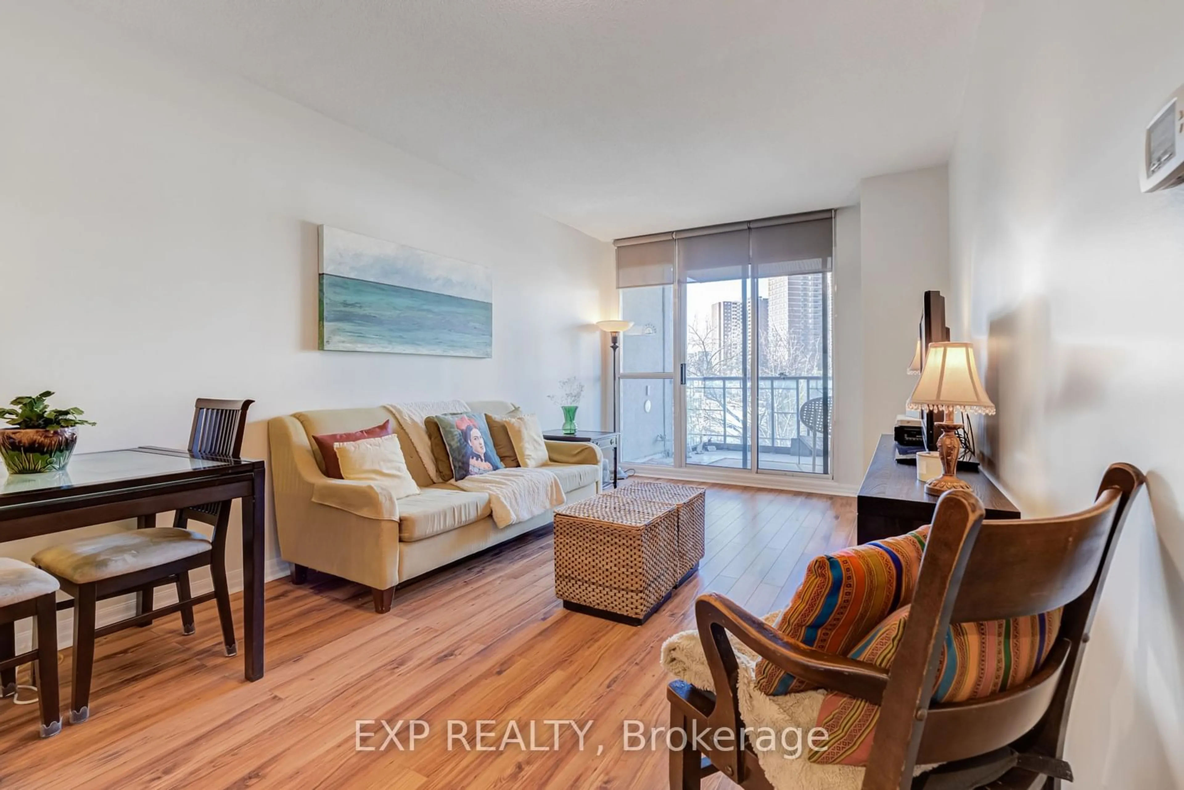 Living room with furniture, wood/laminate floor for 38 Fontenay Crt #410, Toronto Ontario M9A 5H5