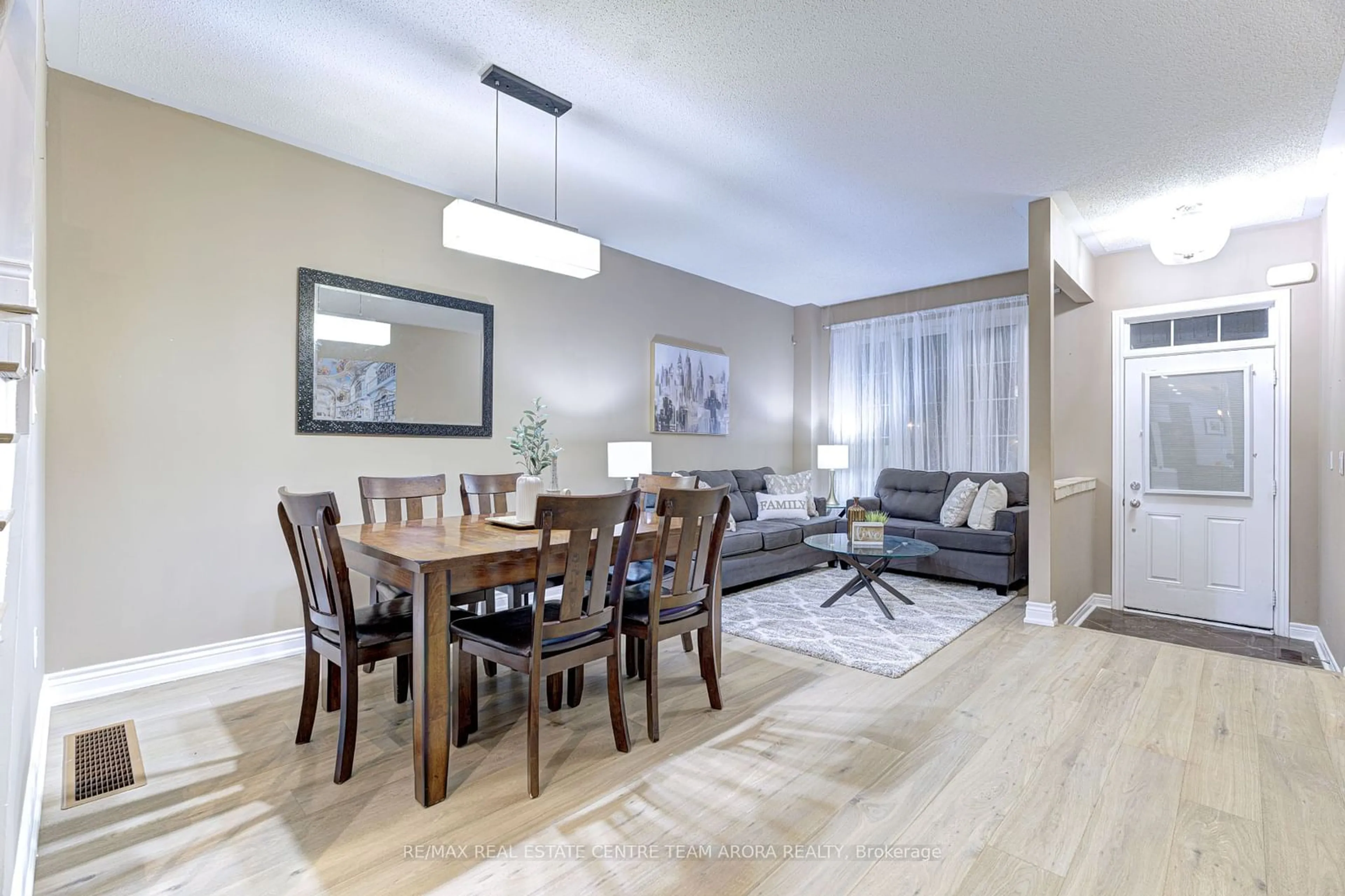 Living room with furniture, wood/laminate floor for 8 Kawana Rd, Brampton Ontario L6Y 0W1