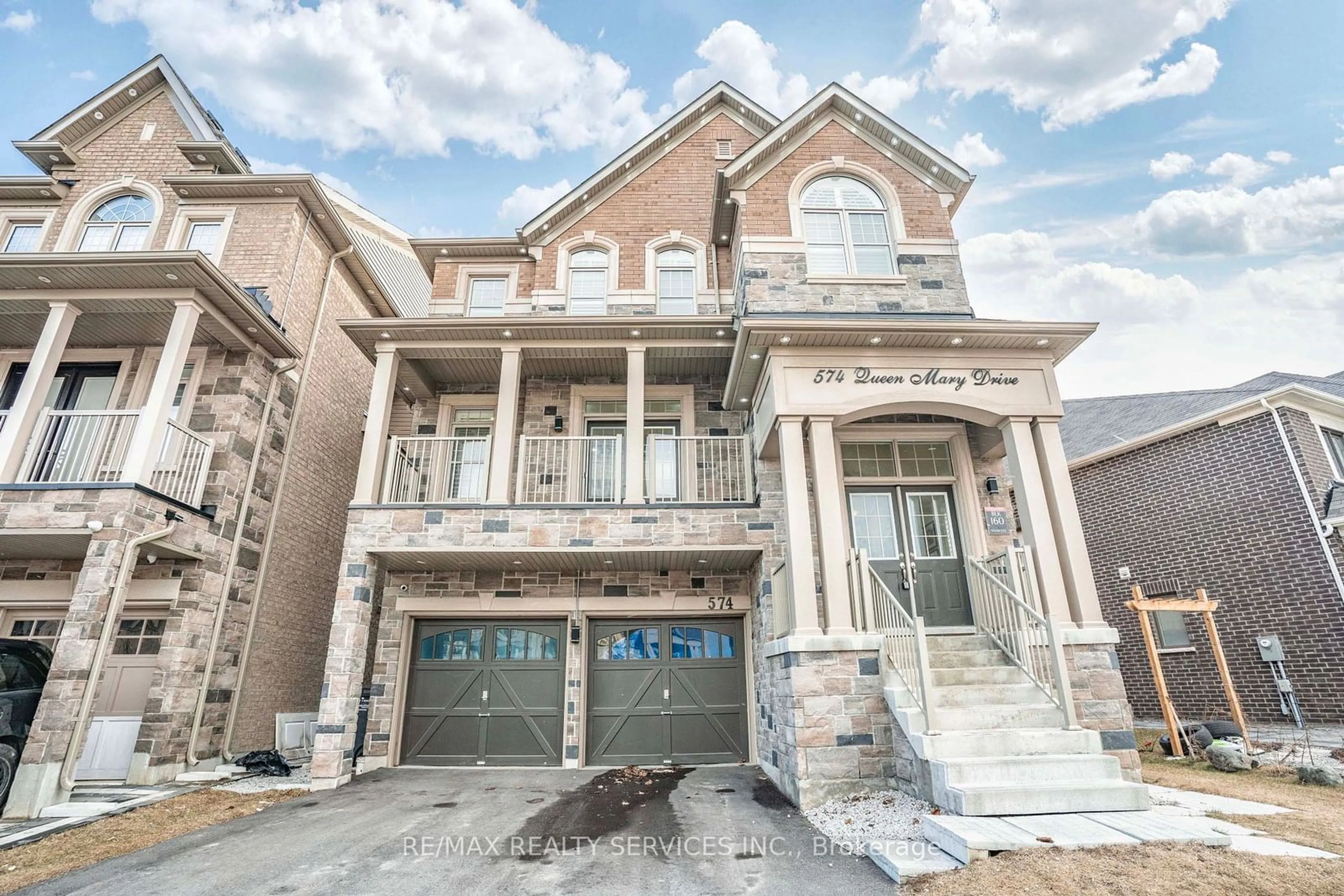 Home with brick exterior material, street for 574 Queen Mary Dr, Brampton Ontario L7A 4Y6