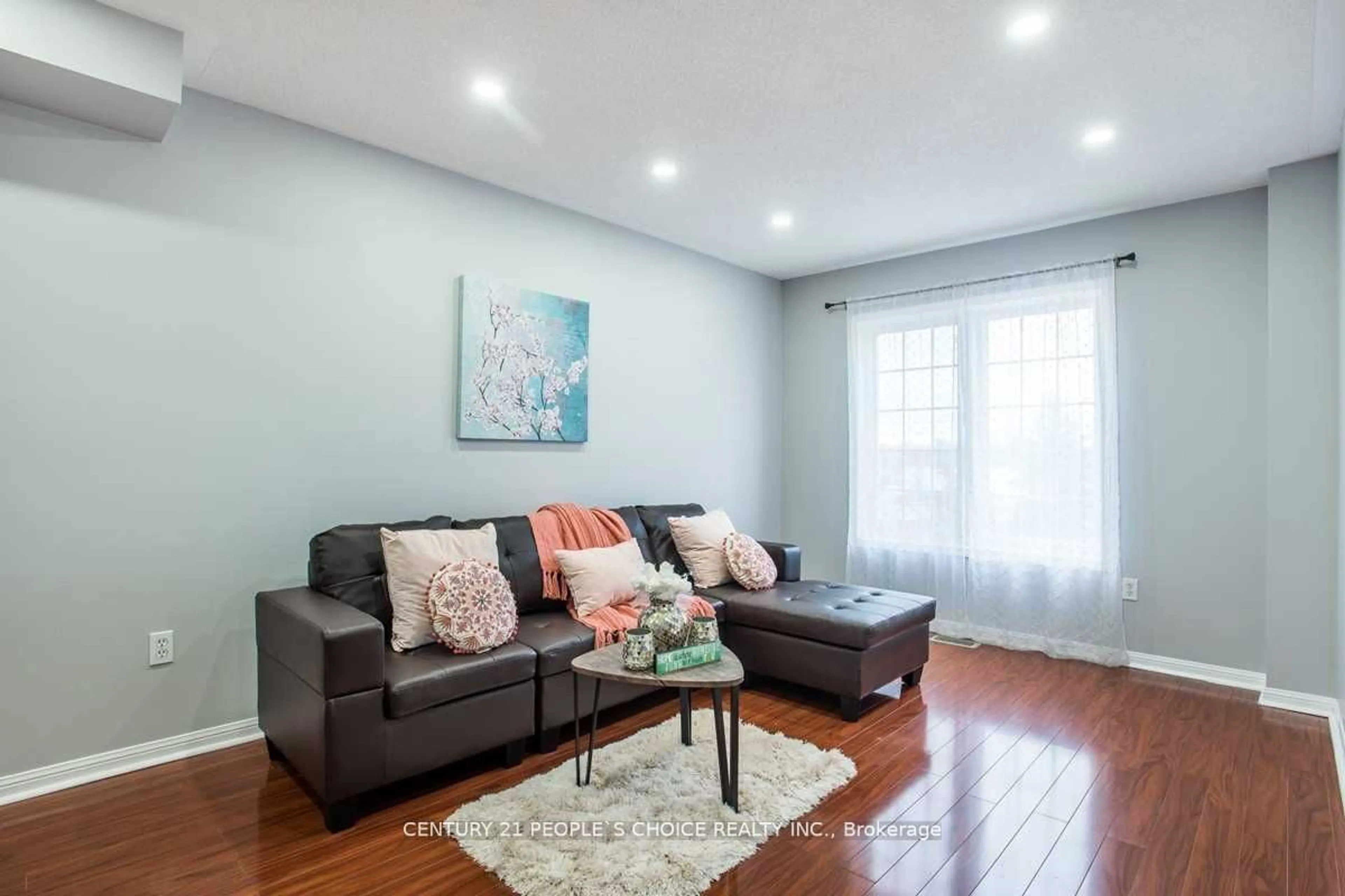 Living room with furniture, wood/laminate floor for 250 Richvale Dr #9, Brampton Ontario L6Z 4W2