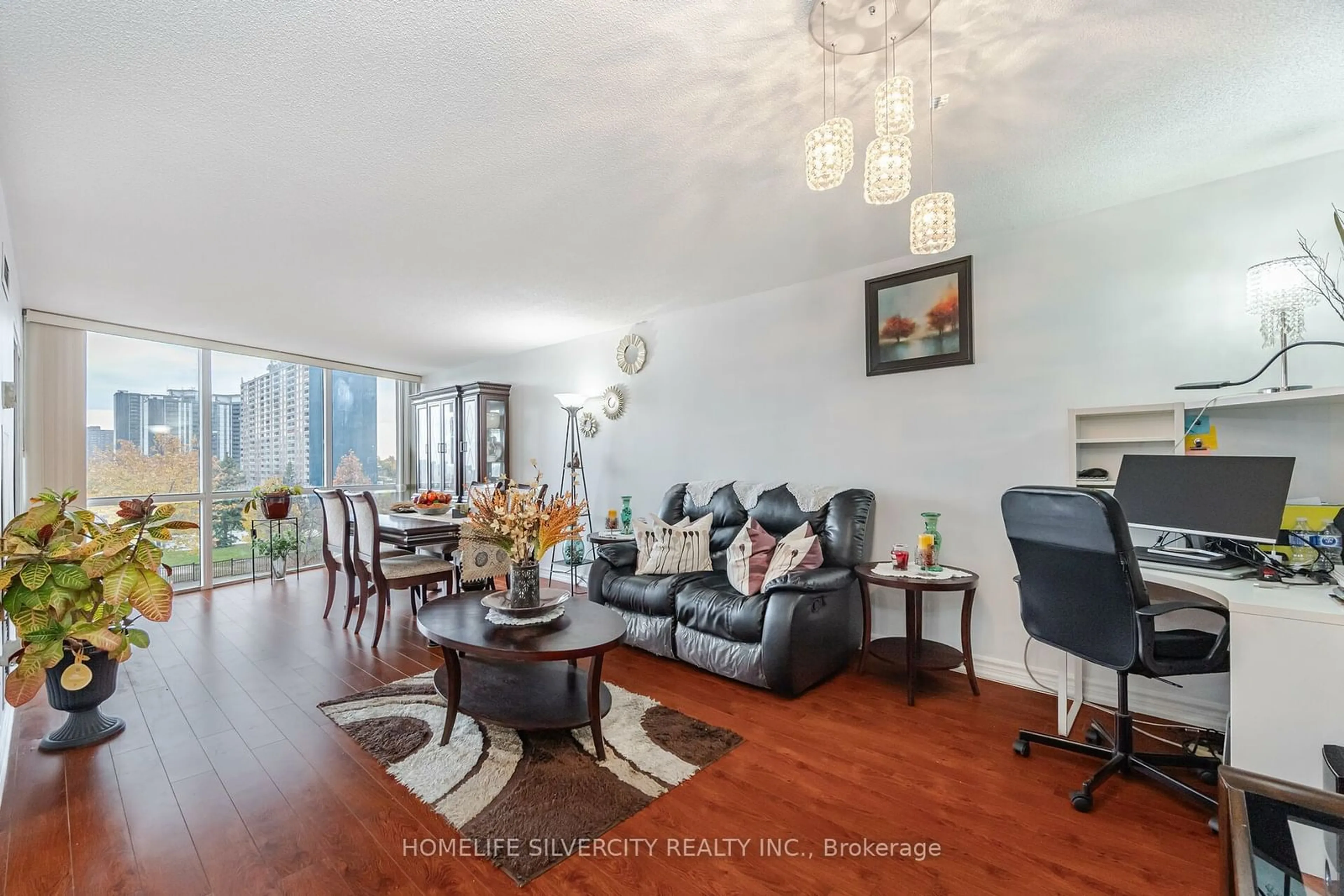 Living room with furniture, wood/laminate floor for 21 Markbrook Lane #407, Toronto Ontario M9V 5E4