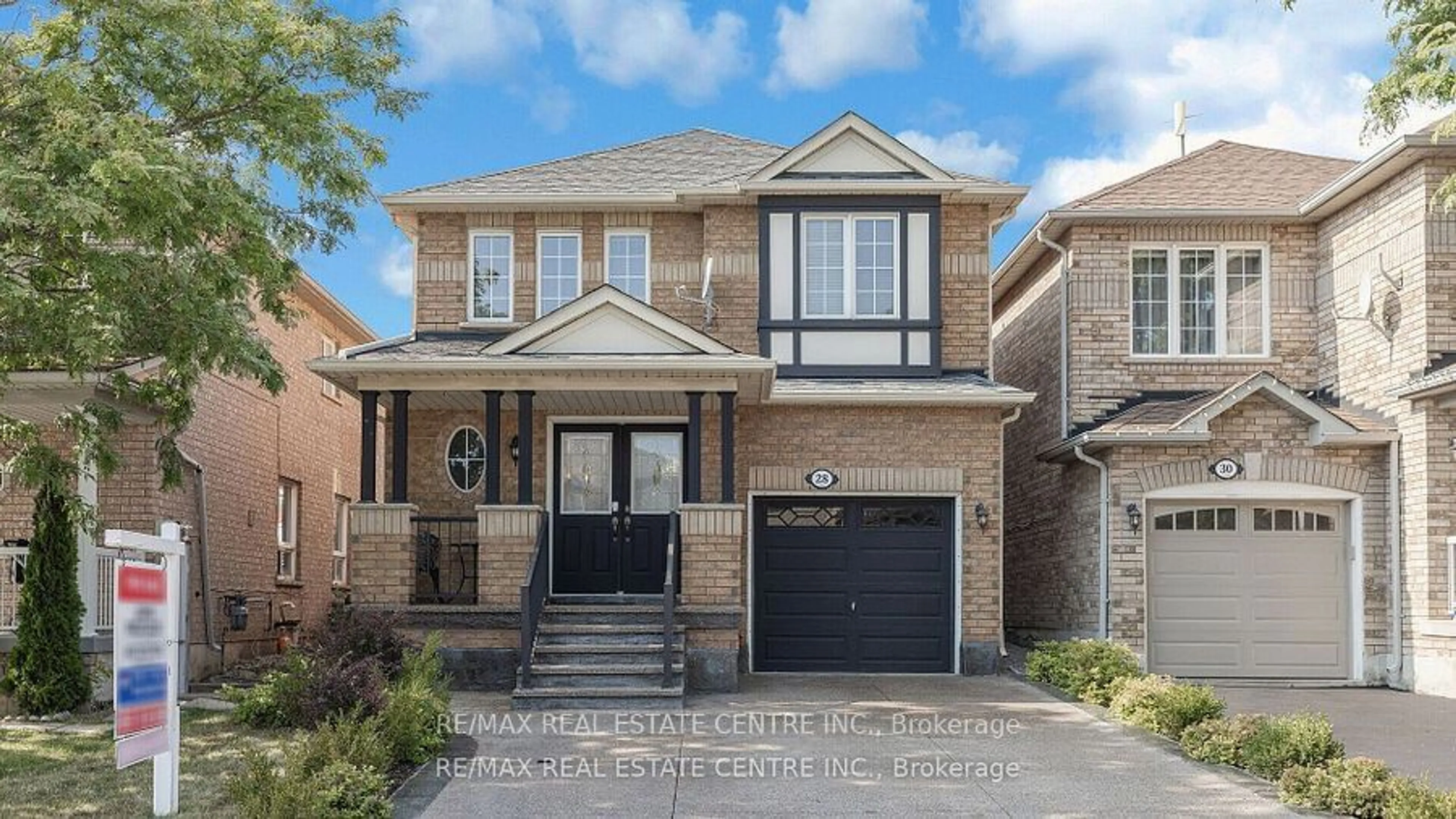 Home with brick exterior material, street for 28 Slessor Lane, Brampton Ontario L6P 1L8