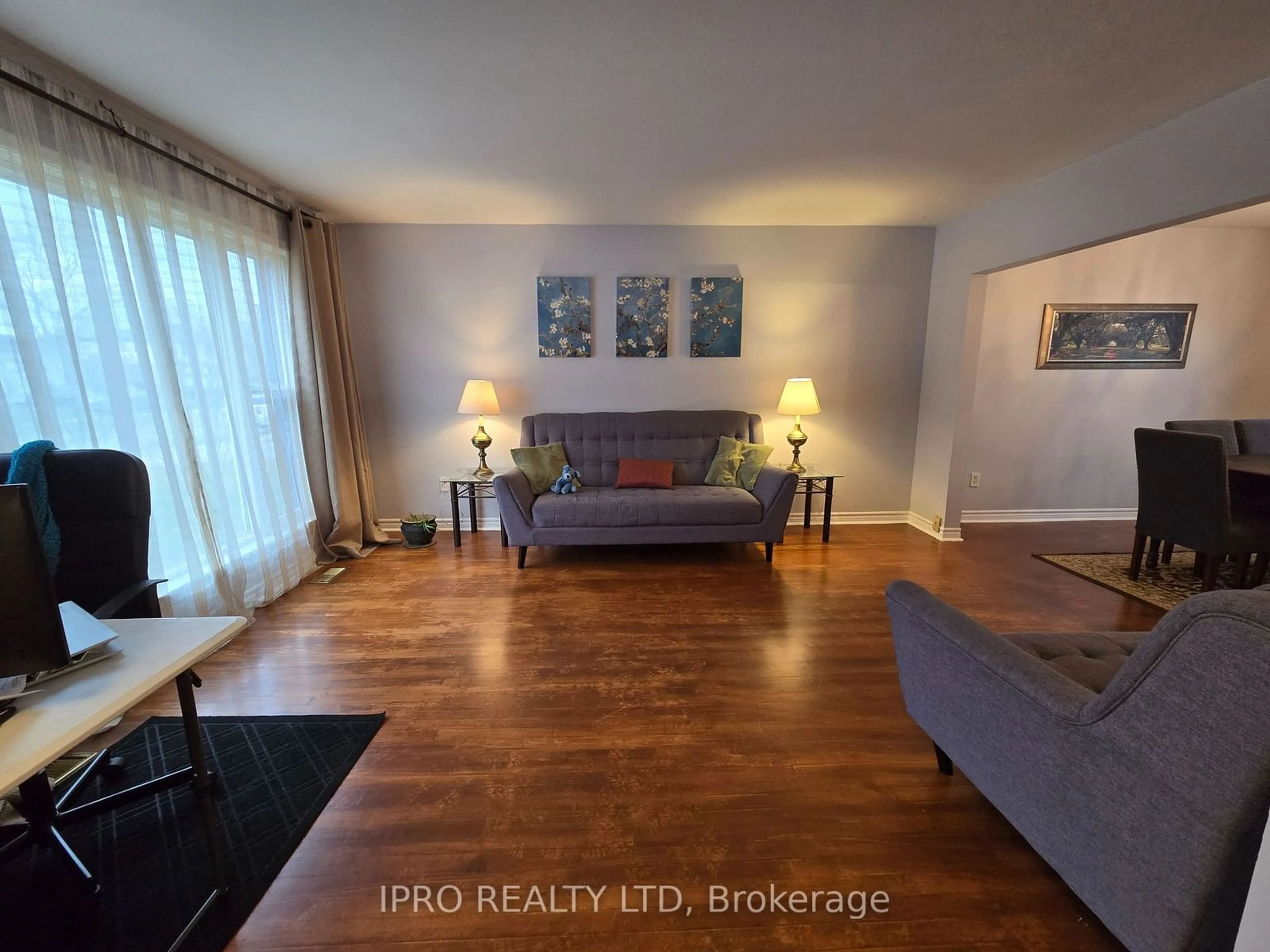 Living room with furniture, wood/laminate floor for 95 Willowridge Rd, Toronto Ontario M9R 3Z5