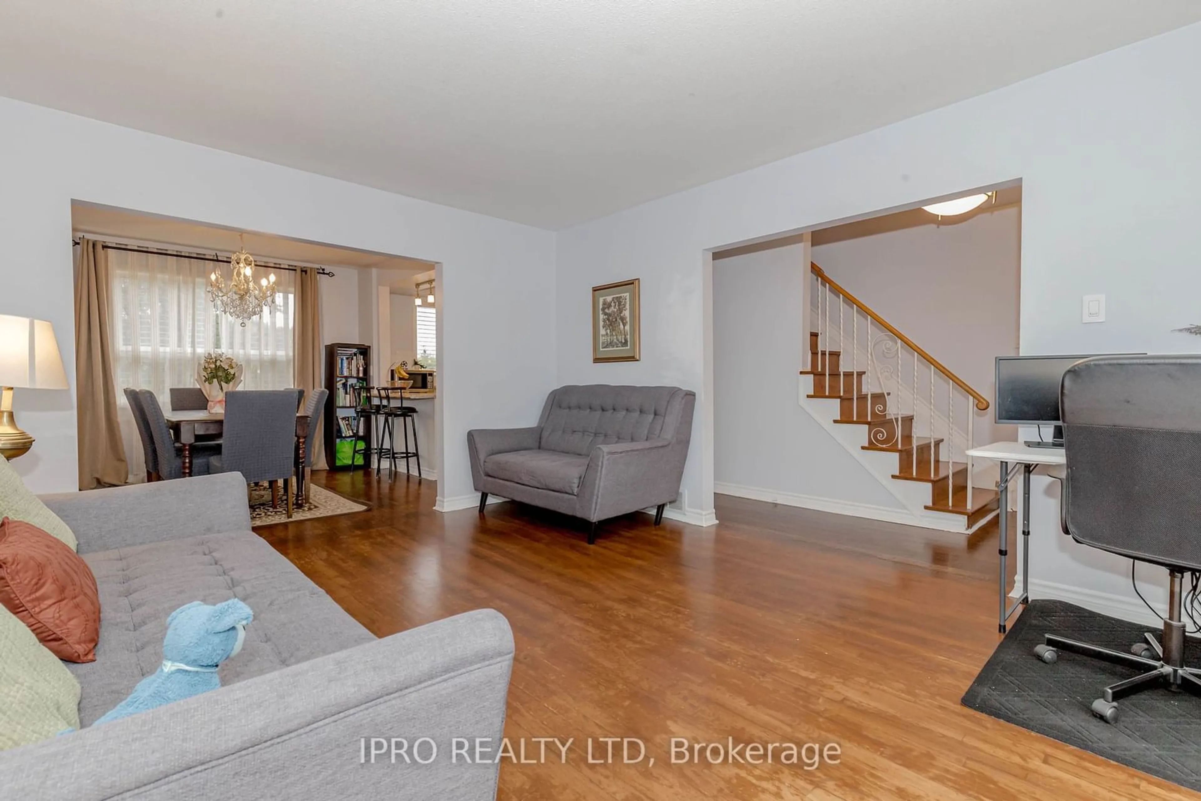 Living room with furniture, wood/laminate floor for 95 Willowridge Rd, Toronto Ontario M9R 3Z5