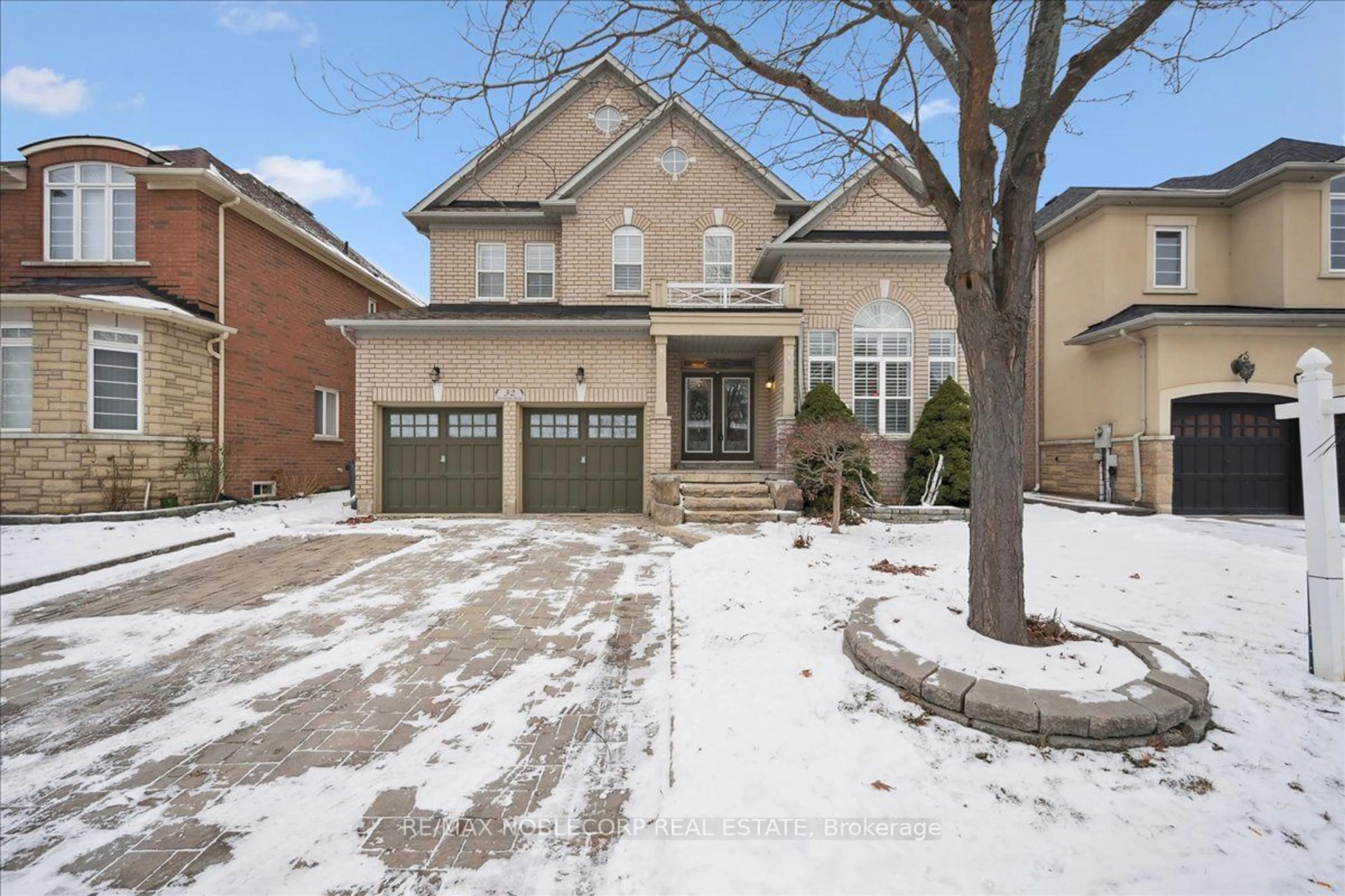 Home with brick exterior material, street for 32 Aristocrat Rd, Brampton Ontario L6P 1X7