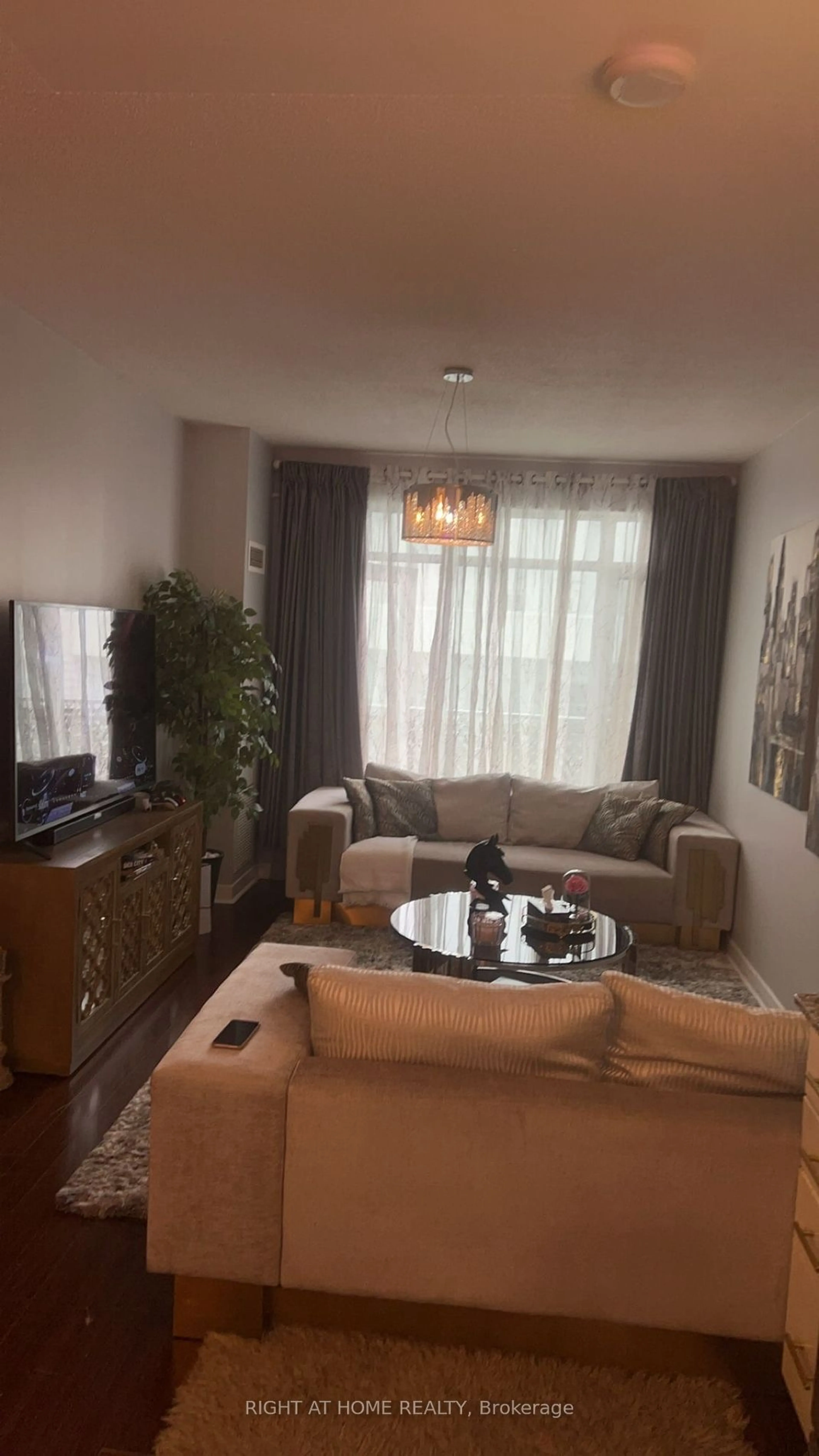 Living room with furniture, wood/laminate floor for 360 Square One Dr #2303, Mississauga Ontario L5B 0E6