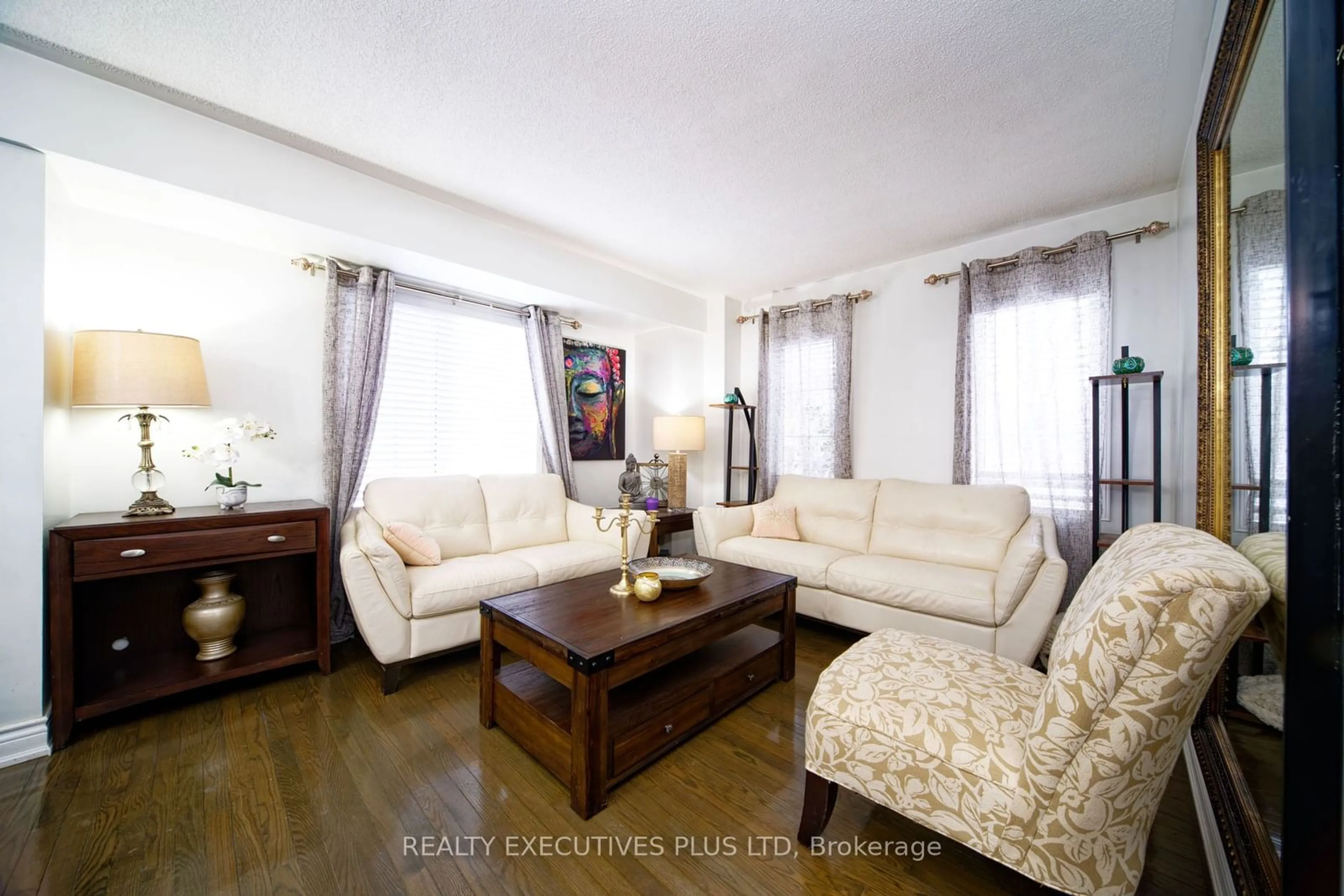 Living room with furniture, wood/laminate floor for 10 Dellview Way #85, Toronto Ontario M3M 3H2