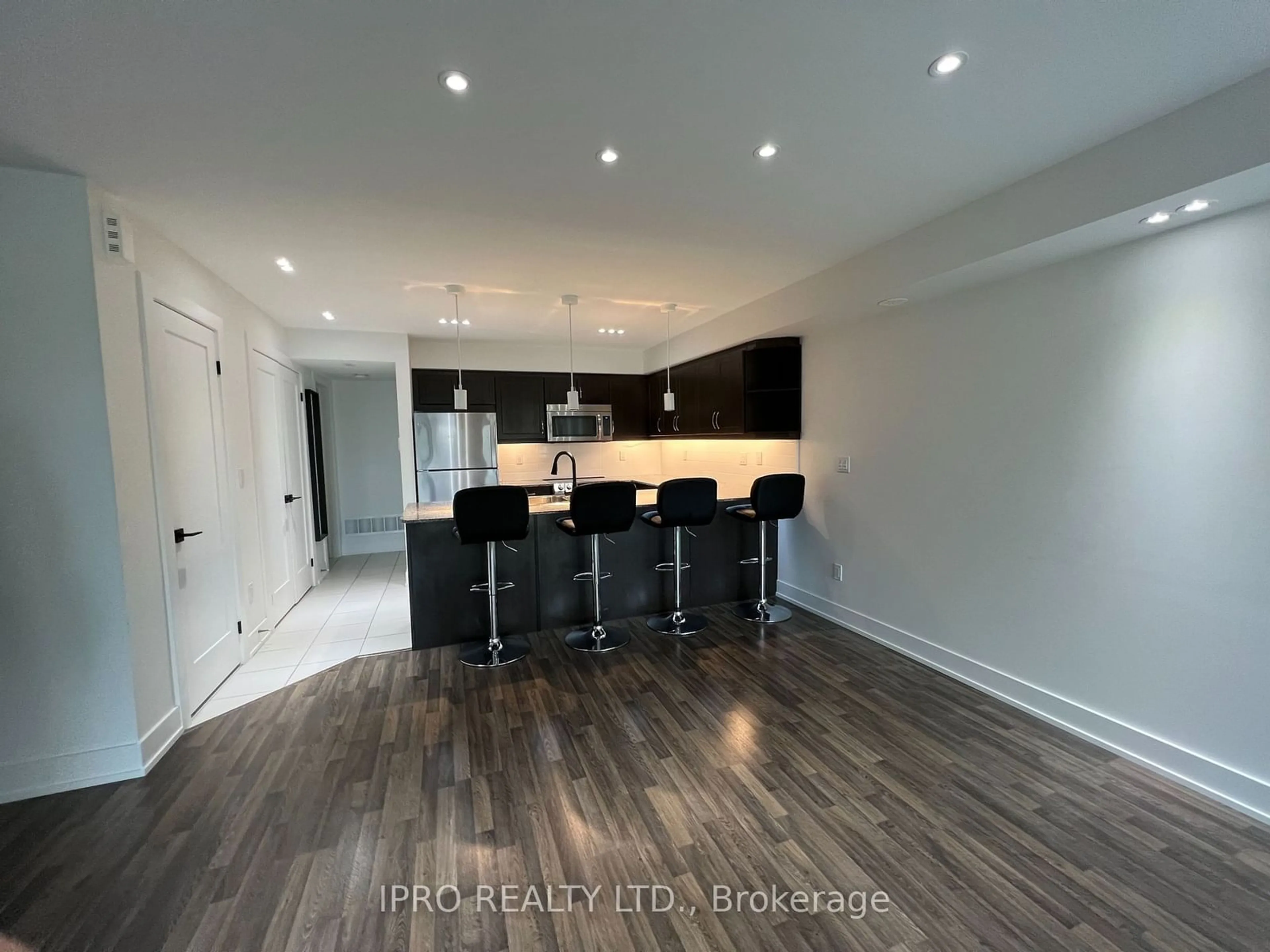 Open concept kitchen, wood/laminate floor for 132 Widdicombe Hill Blvd #307, Toronto Ontario M9R 0A9