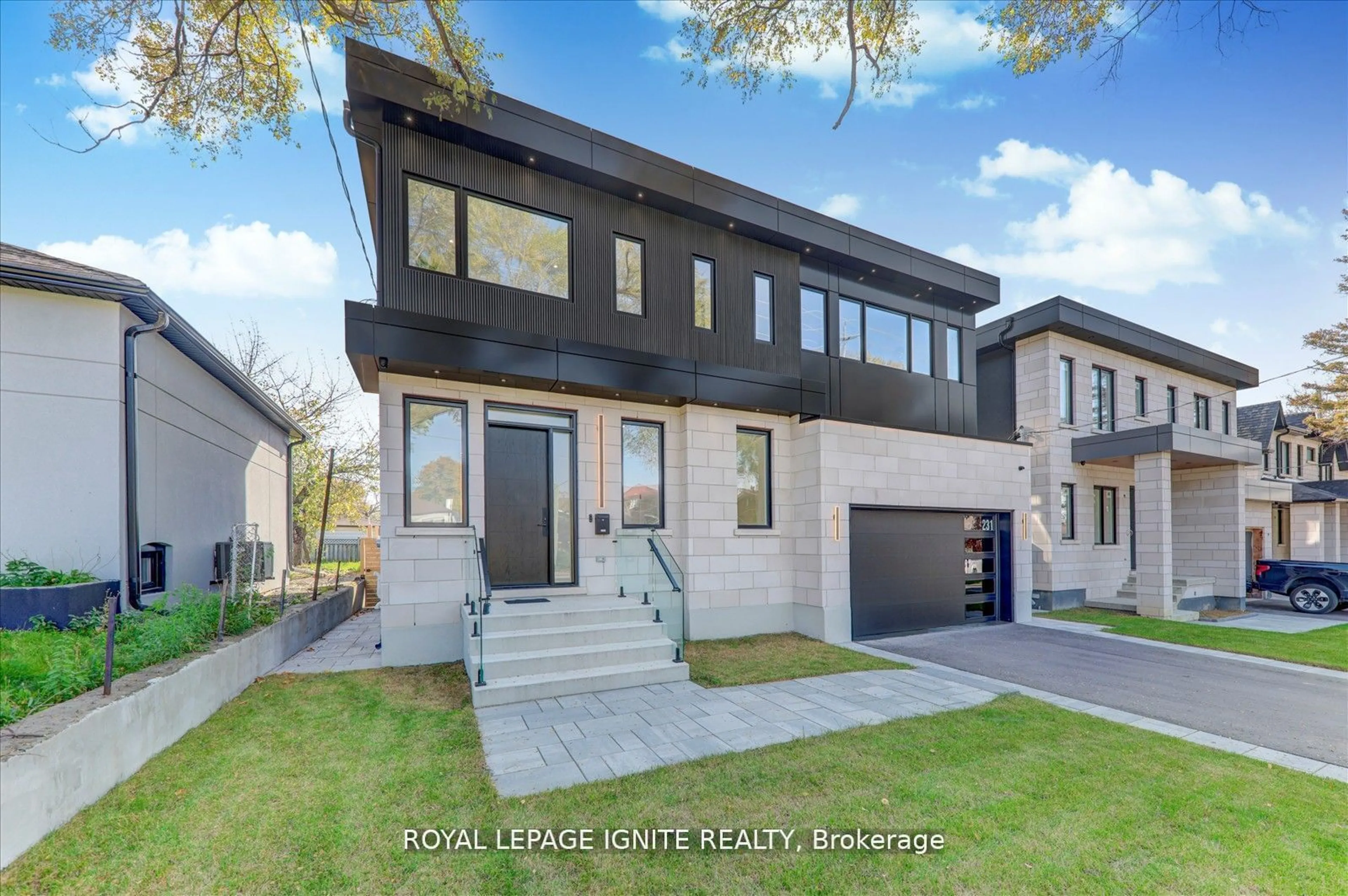 Home with brick exterior material, street for 231 Falstaff Ave, Toronto Ontario M6L 2G2