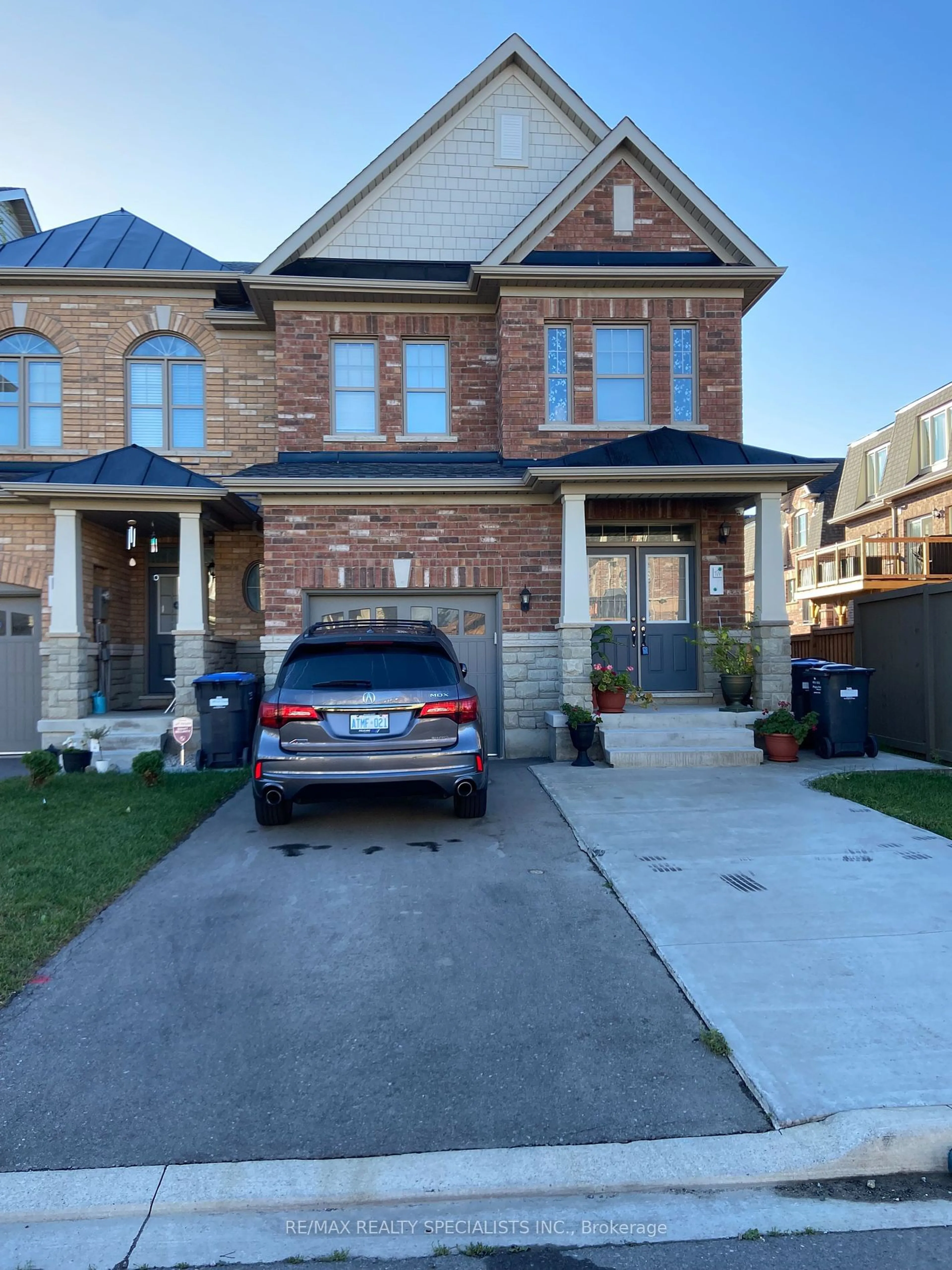 Home with brick exterior material, street for 14 Merrybrook Tr, Brampton Ontario L7A 4W1